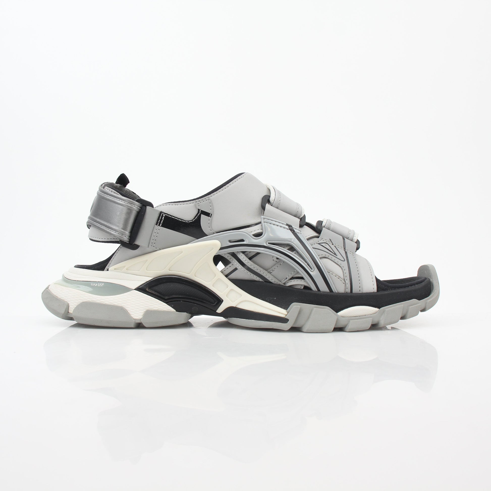 Grey Balenciaga track sandals by Gold & Beyond, showcasing their sporty design and chunky sole in a close-up shot.