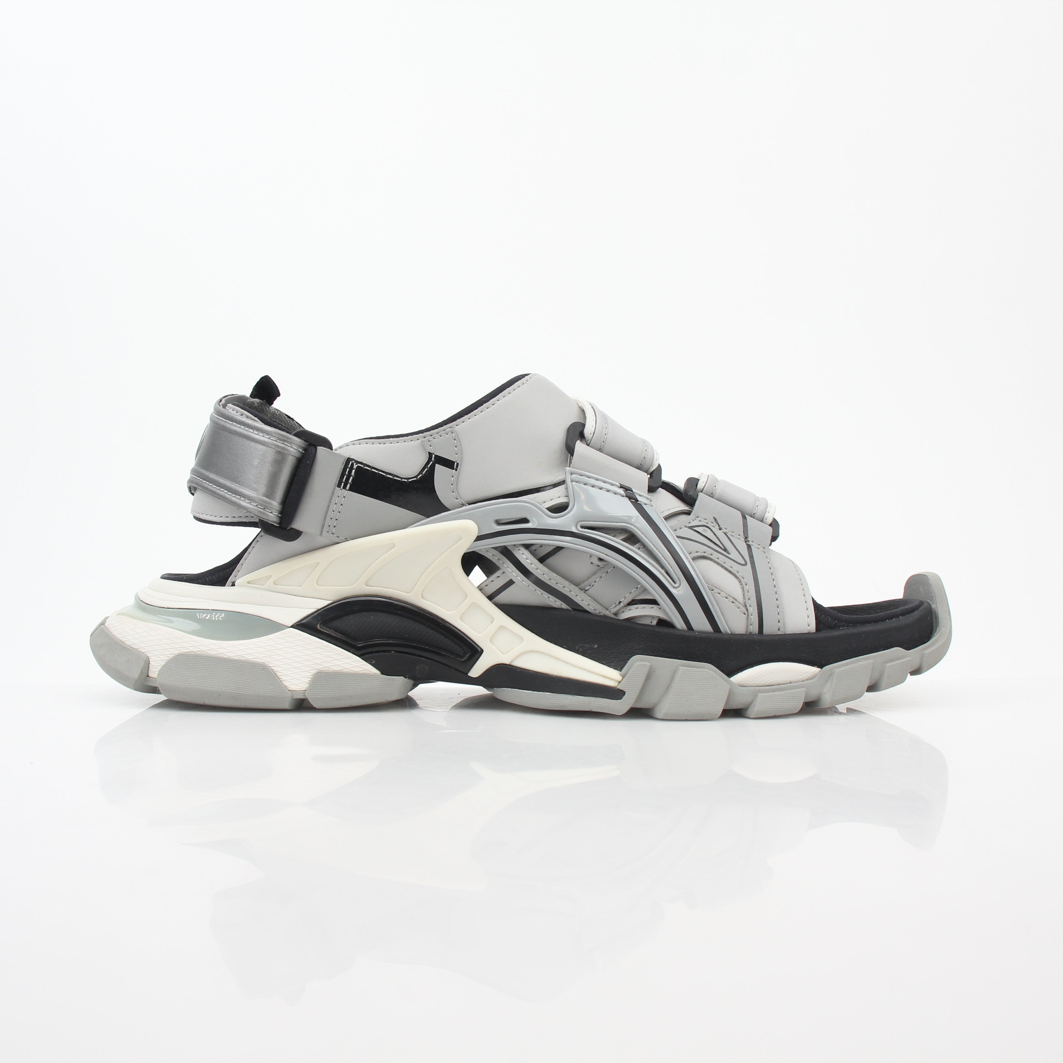Grey Balenciaga track sandals by Gold & Beyond, showcasing their sporty design and chunky sole in a close-up shot.