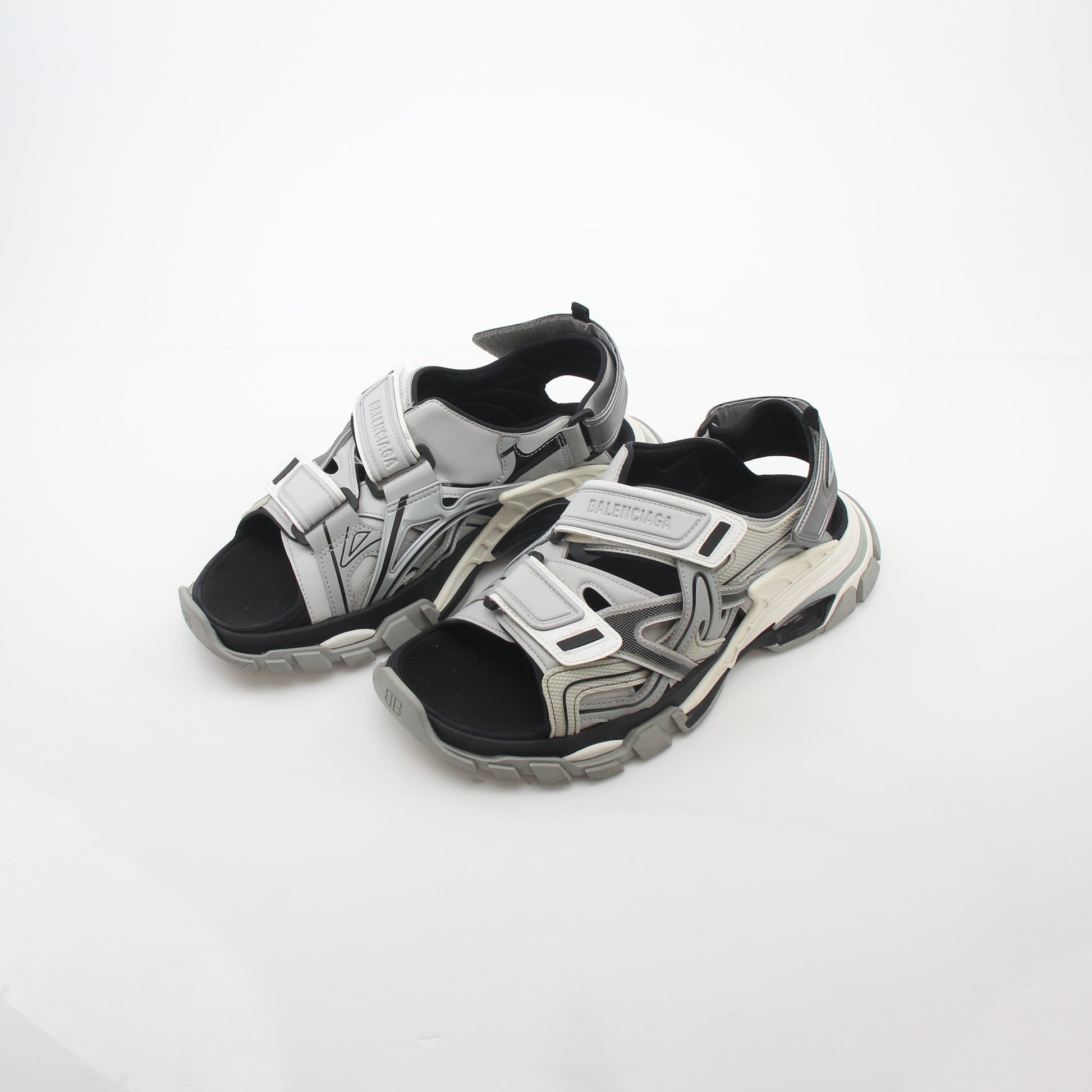 Grey Balenciaga track sandals featuring sporty design and chunky sole, displayed on a neutral background.