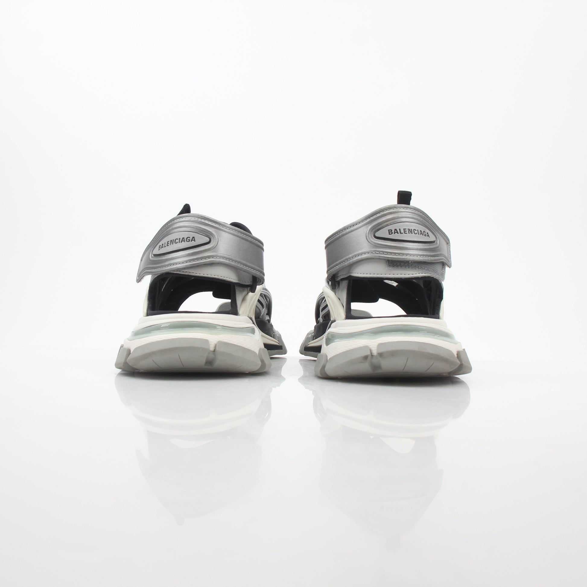Grey Balenciaga track sandals with sporty design and chunky sole, displayed on a plain background.
