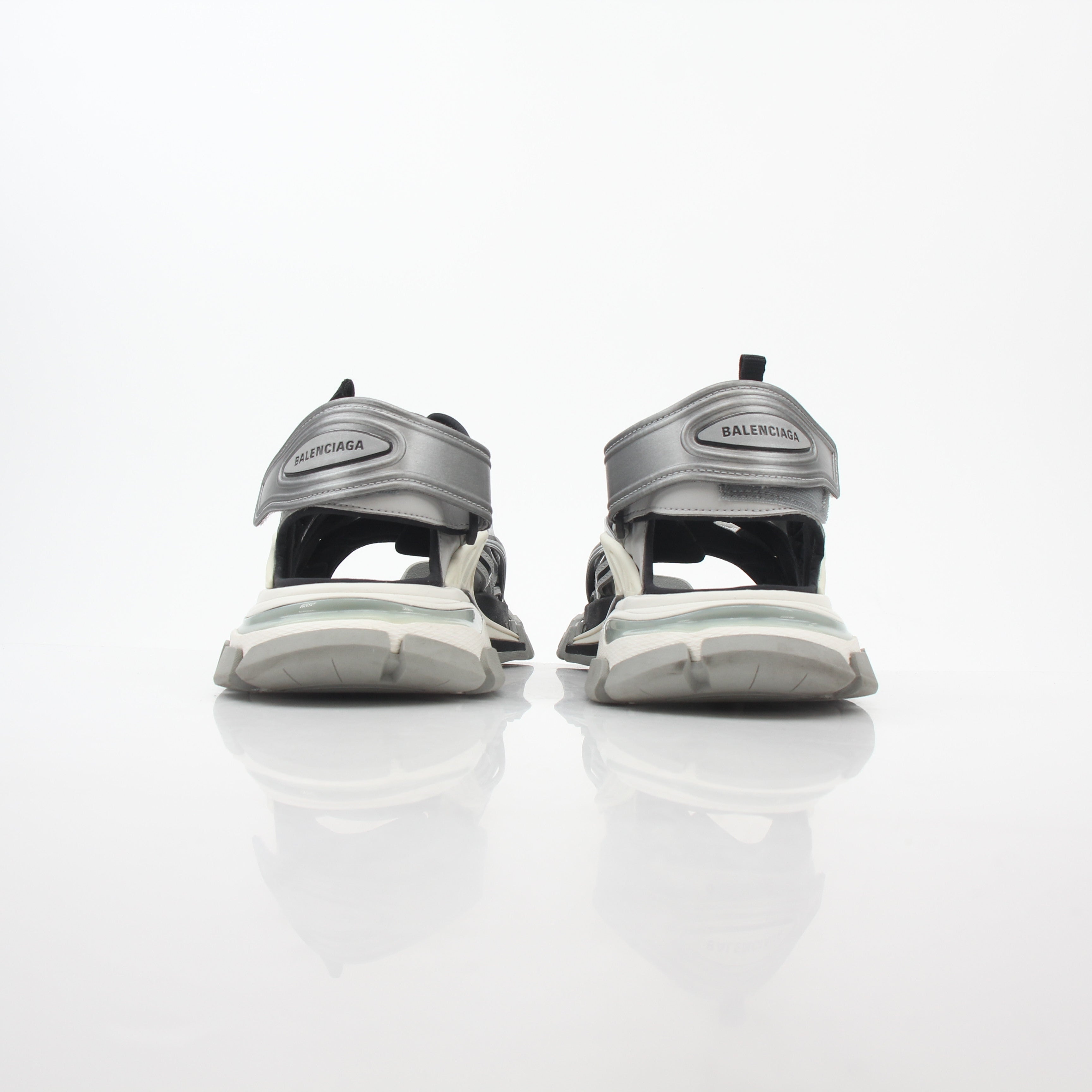 Grey Balenciaga track sandals with sporty design and chunky sole, displayed on a plain background.