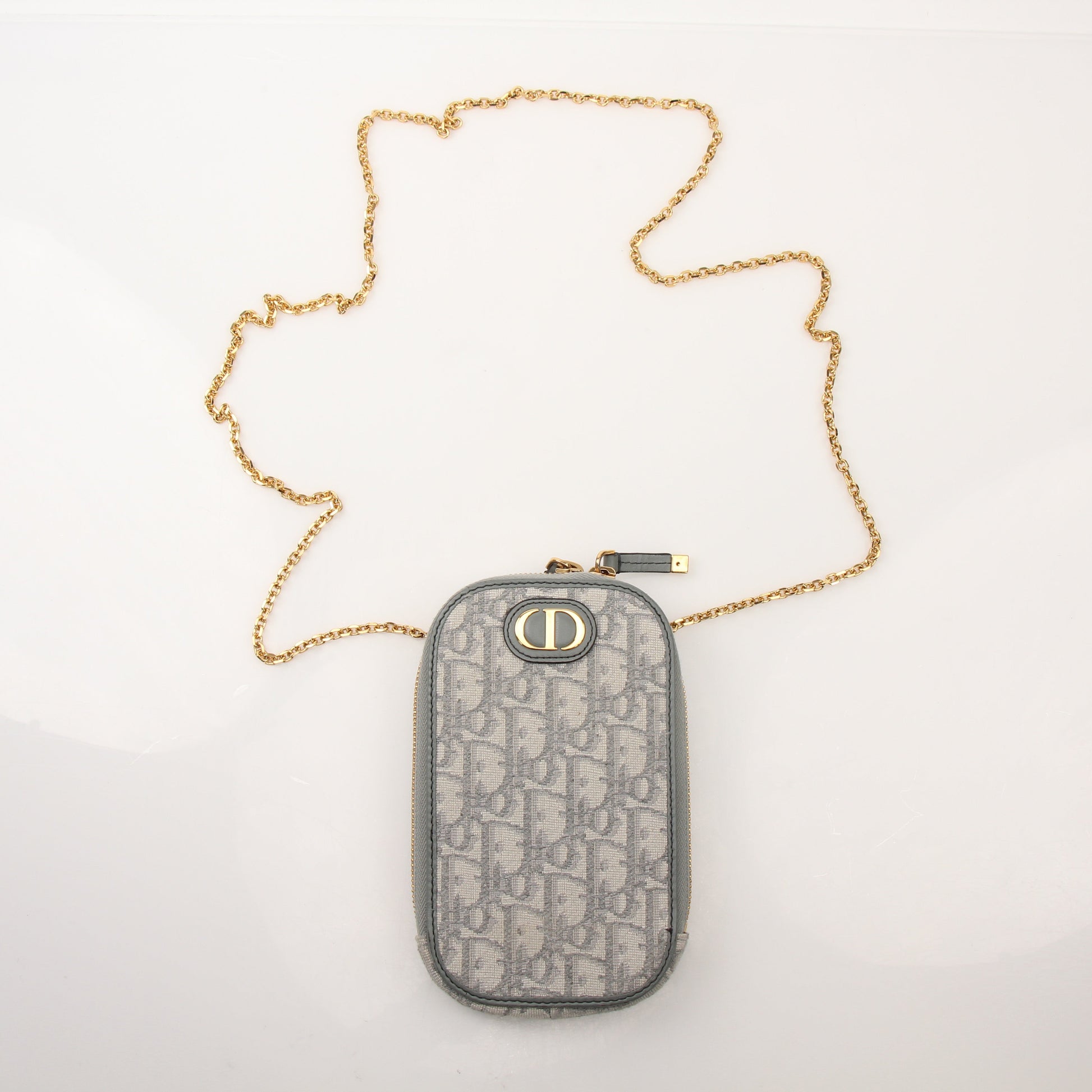 Christian Dior 30 Montaigne Call’in Dior phone holder handbag with gold accents and sleek design, by Gold & Beyond.