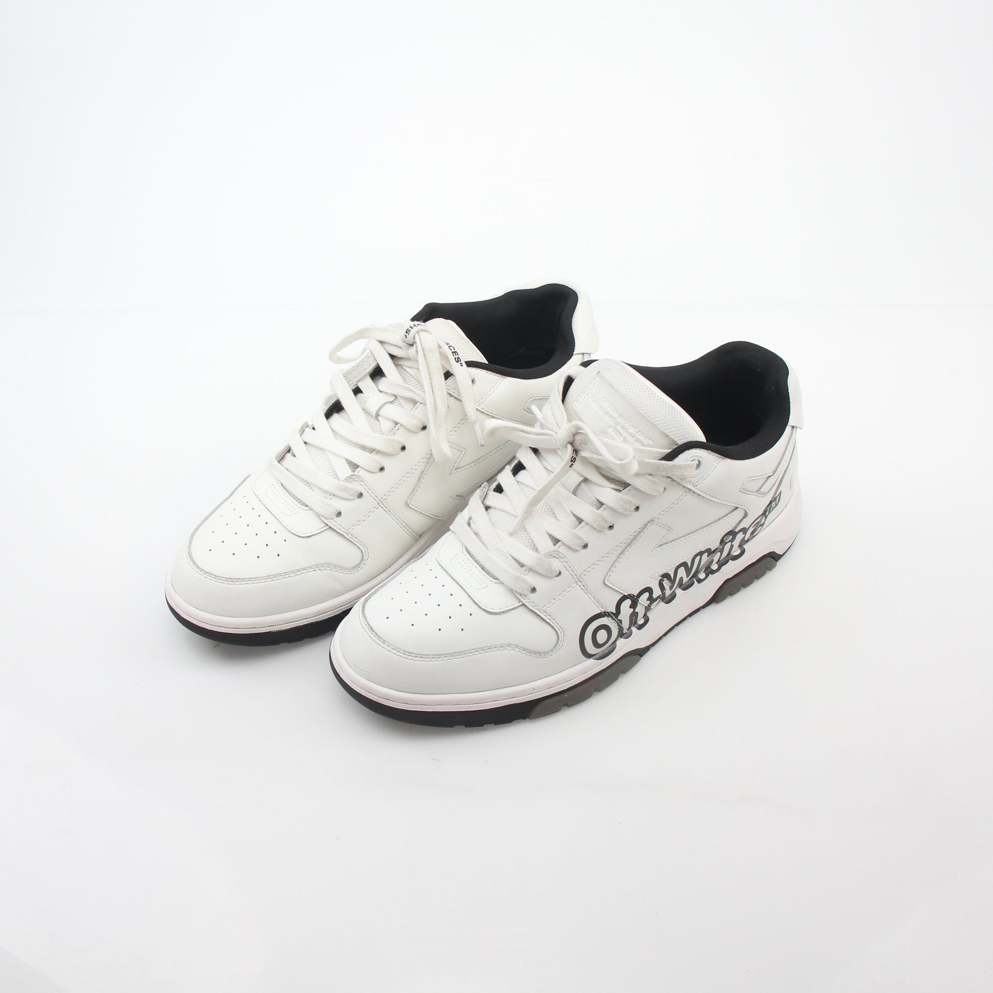 White Off-White Out Of Office graffiti logo sneakers featuring stylish design and branding, displayed on a clean background.