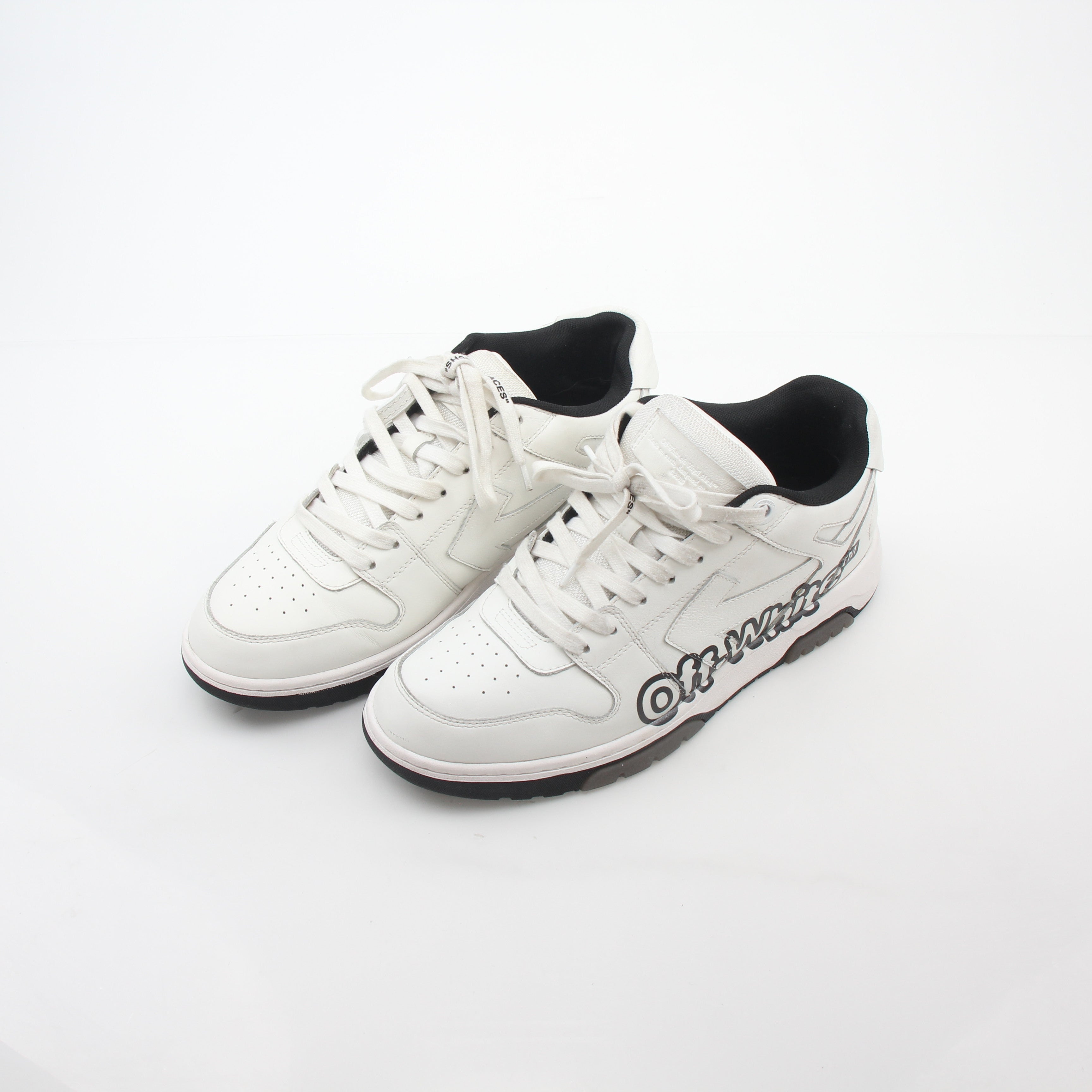 White Off-White Out Of Office graffiti logo sneakers featuring stylish design and branding, displayed on a clean background.