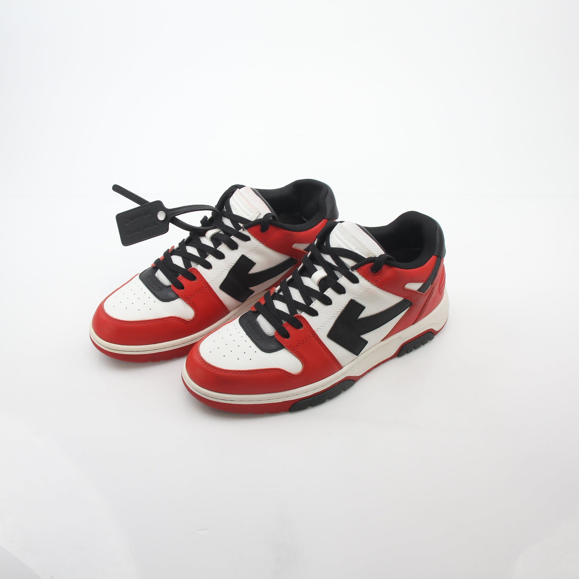 Off-White Out Of Office sneakers in red, white, and black, featuring bold design and signature branding, by Gold & Beyond.