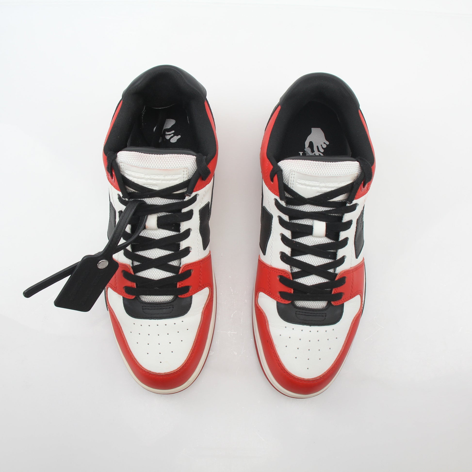 Off-White red, white, and black Out Of Office sneakers with stylish design, displayed on a plain background.