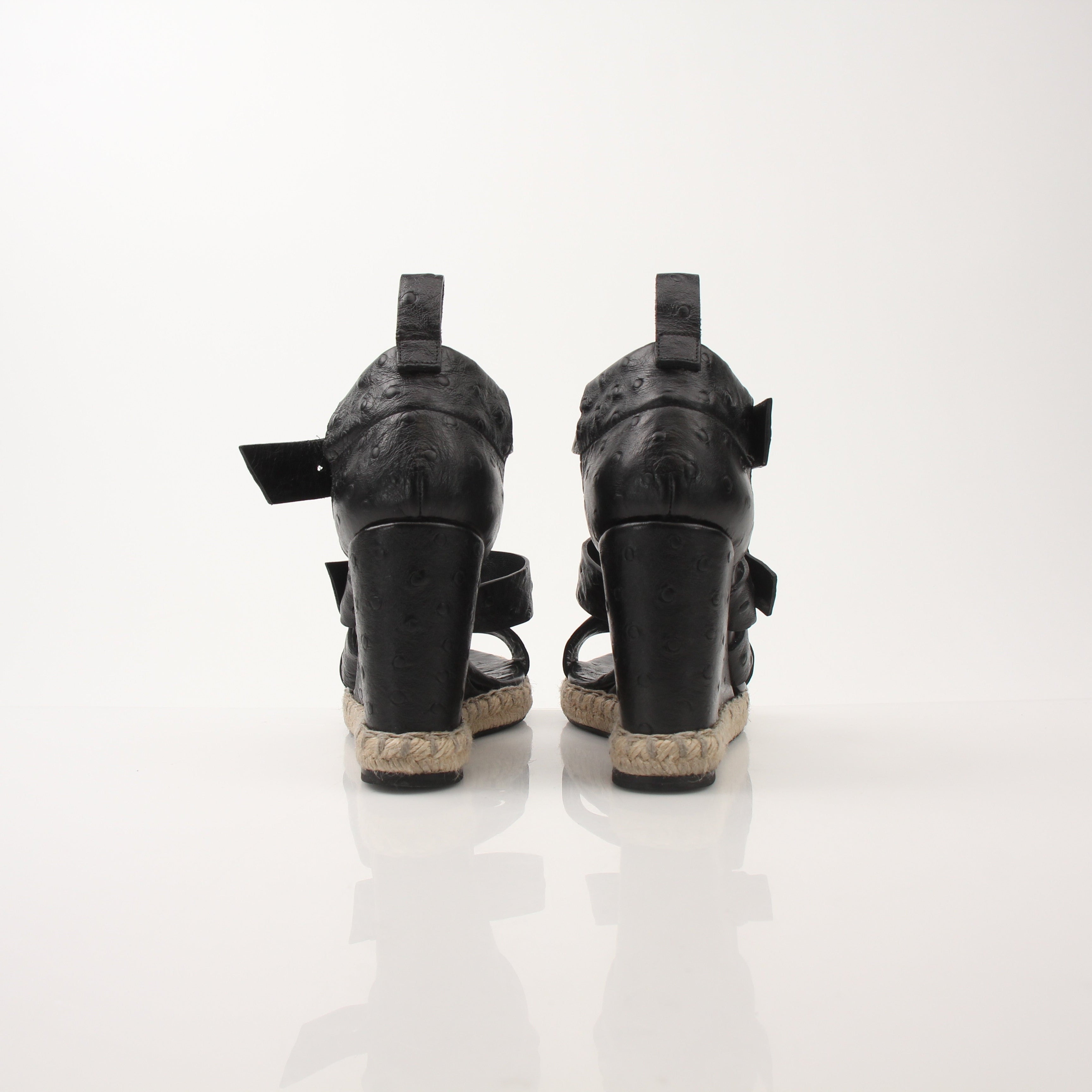 Gold & Beyond Balenciaga Ostrich Wedge Espadrille Sandals featuring black ostrich leather and woven espadrille wedge heel.