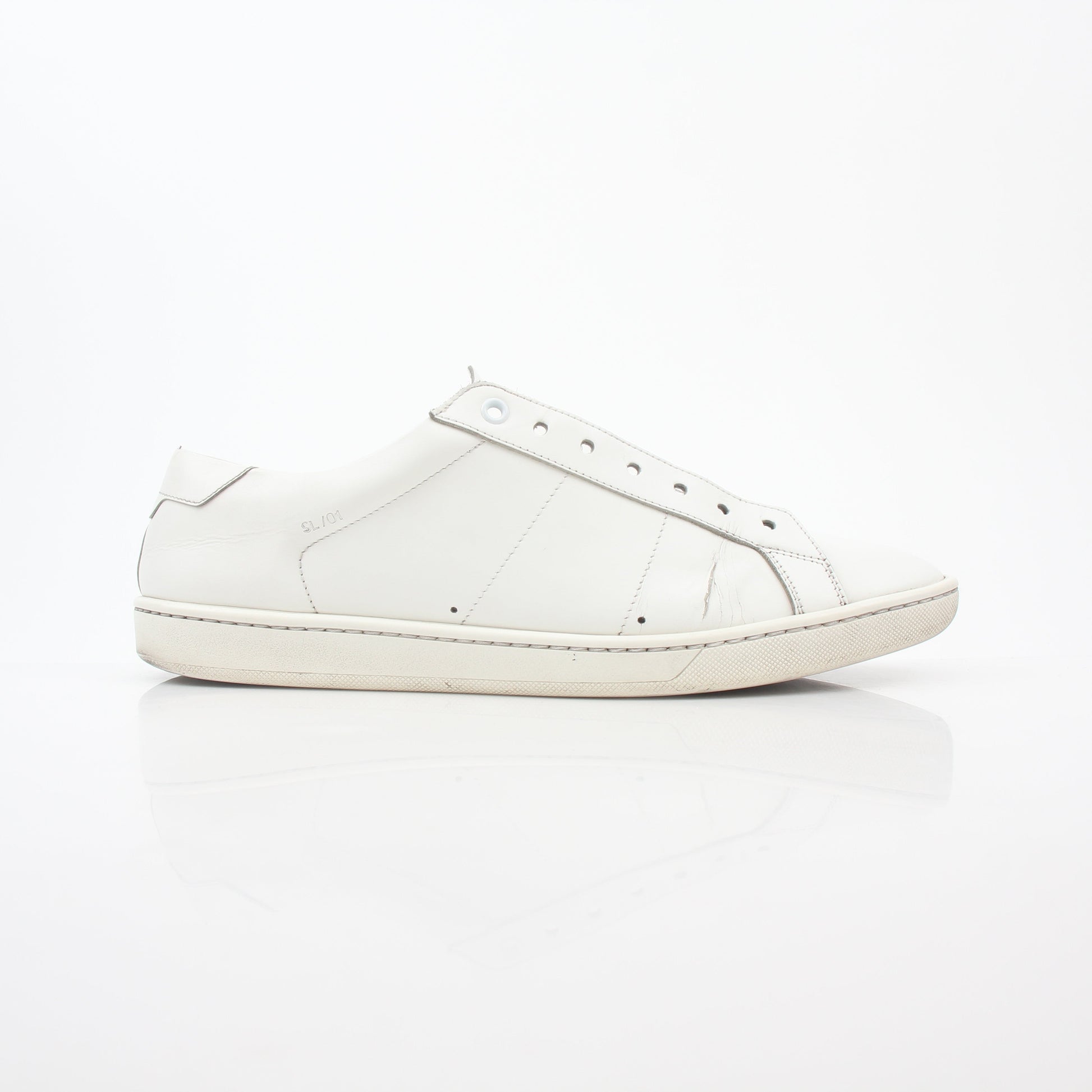 White Saint Laurent SL/06 Court Classic Sneakers with gold accents, displayed on a plain background.