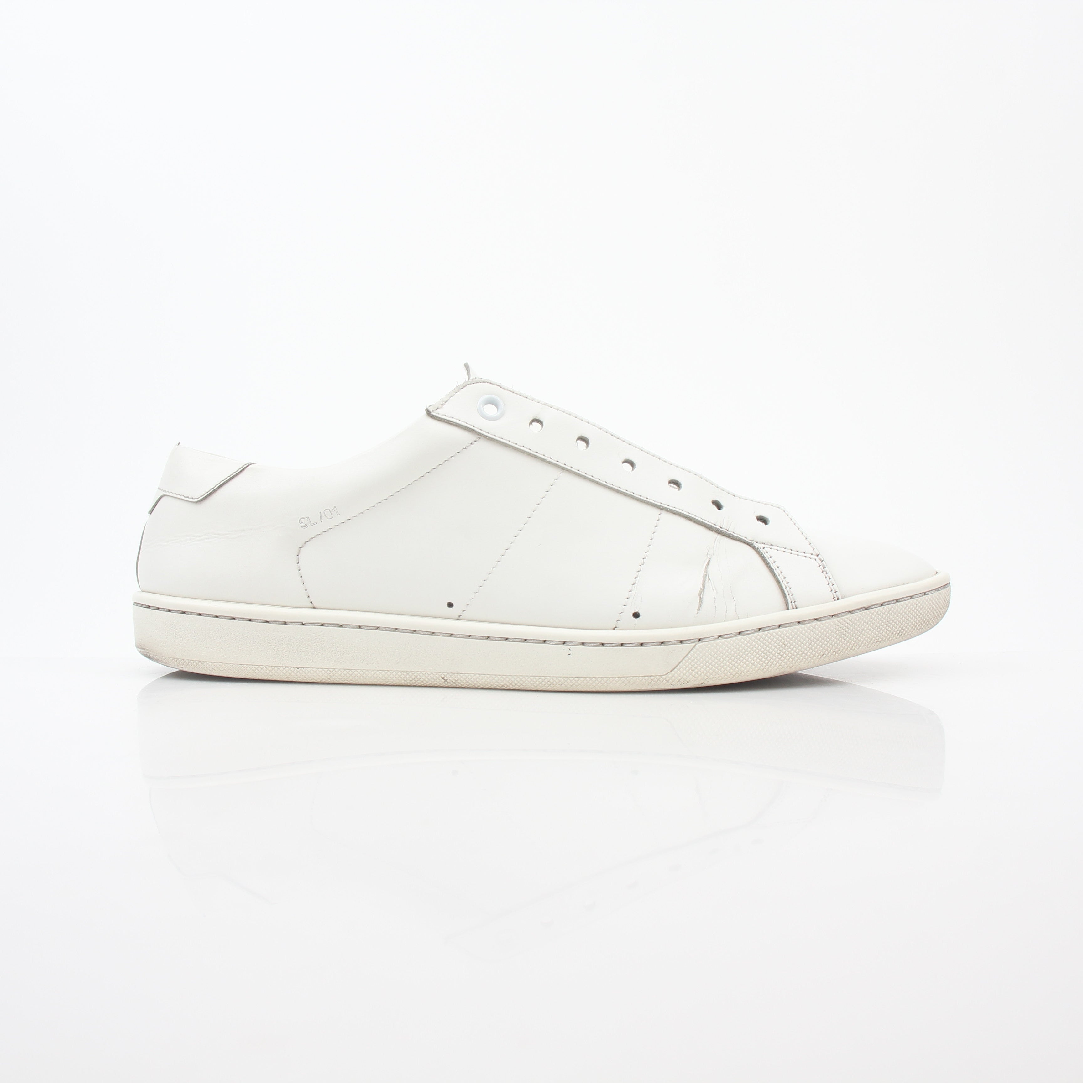 White Saint Laurent SL/06 Court Classic Sneakers with gold accents, displayed on a plain background.