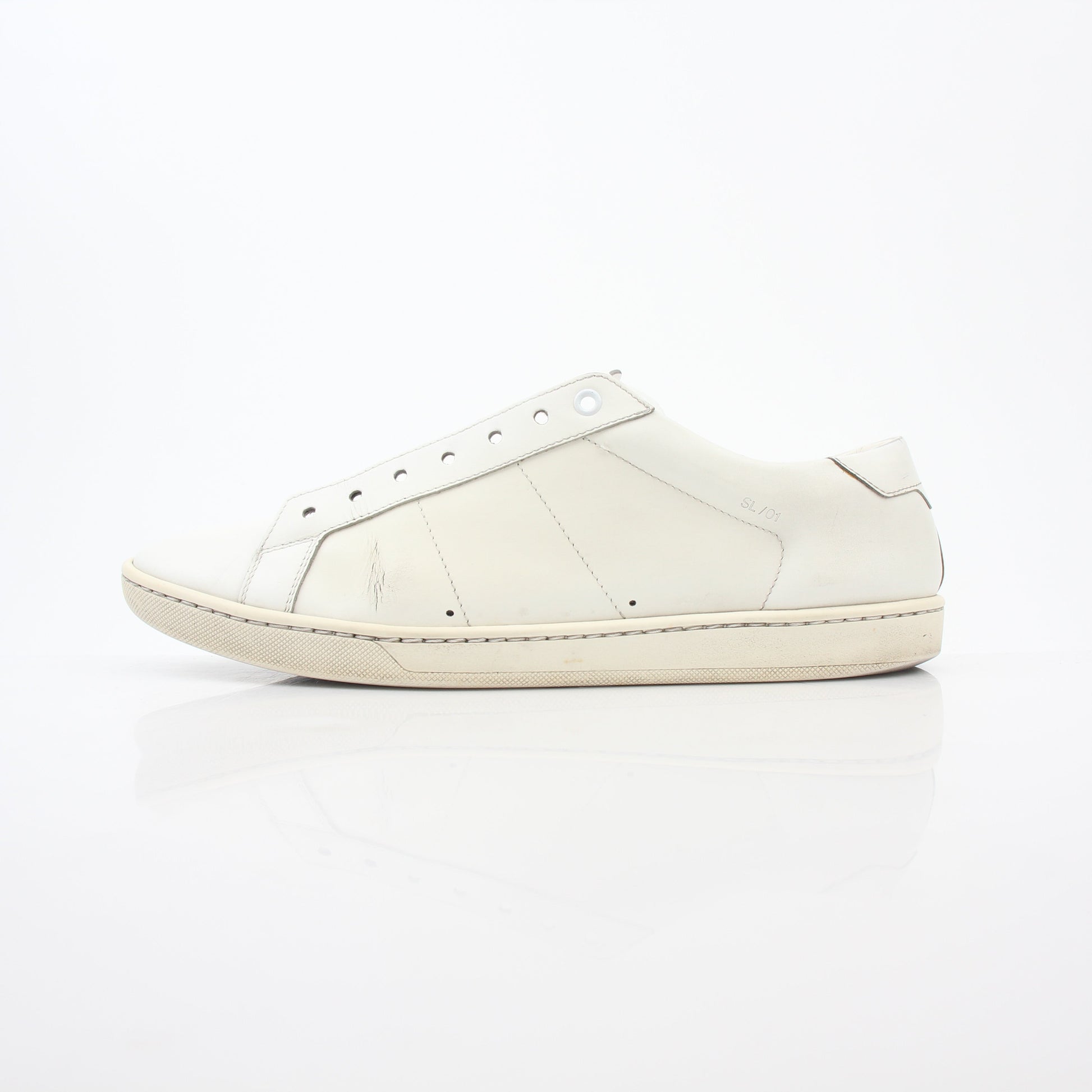 White Saint Laurent SL/06 Court Classic sneakers with gold accents, stylish shoes from Gold & Beyond, shown on clean background.