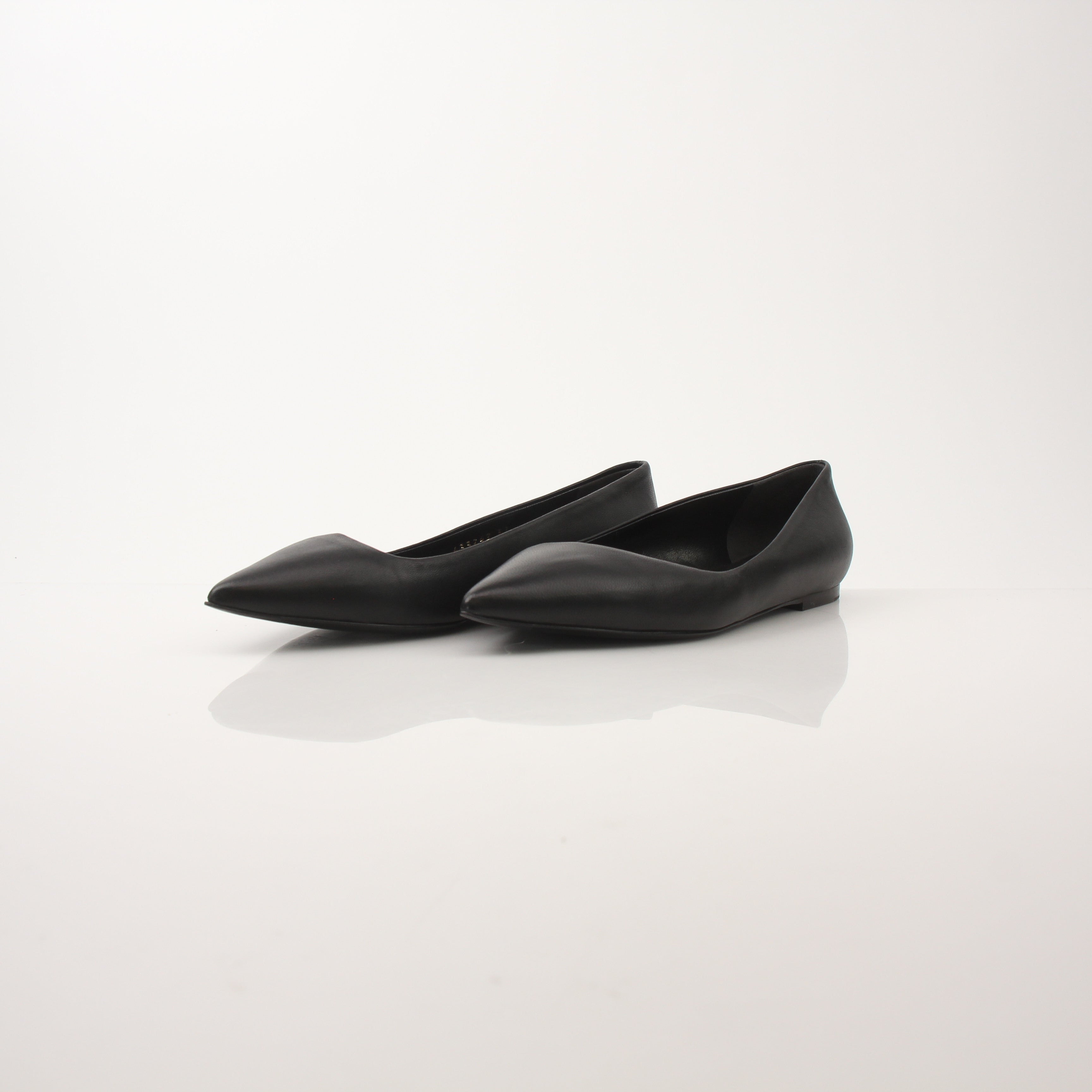 Gold & Beyond leather pointed-toe flats with sleek design and detailed stitching, perfect for stylish everyday wear.