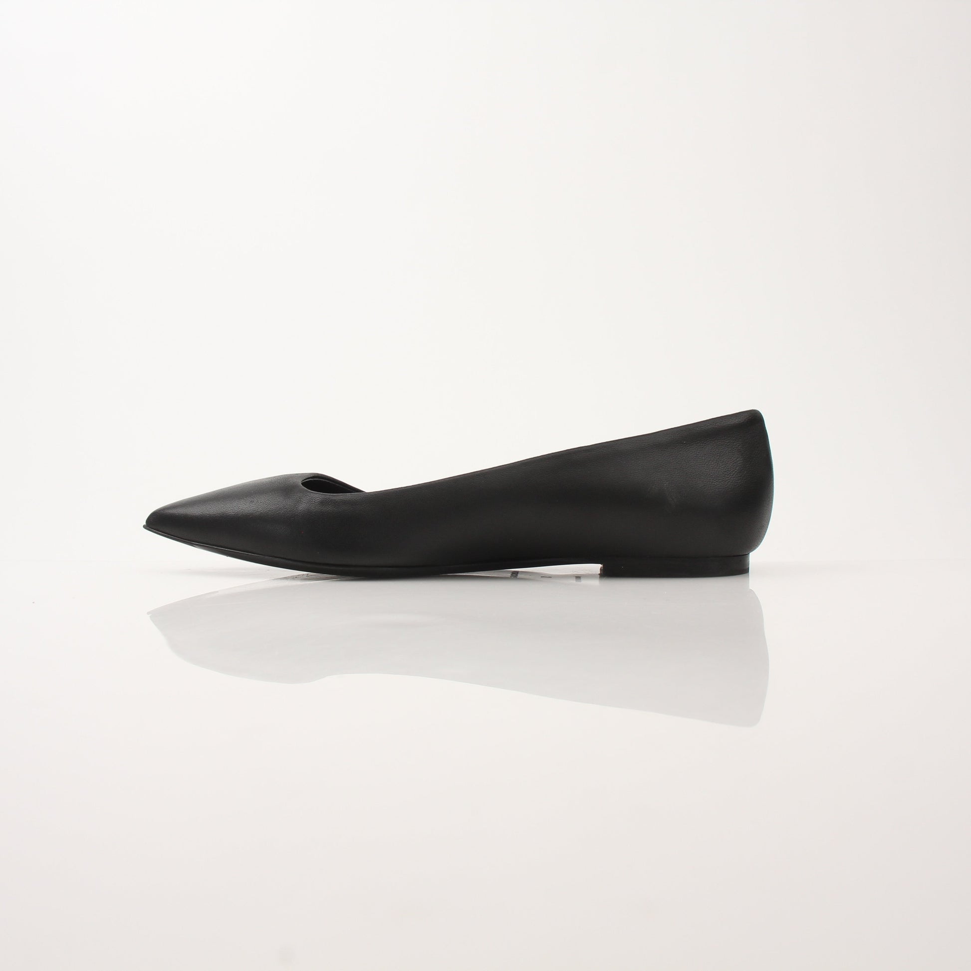 Gold & Beyond leather pointed-toe flats, stylish Balenciaga shoes with sleek design and smooth leather finish.
