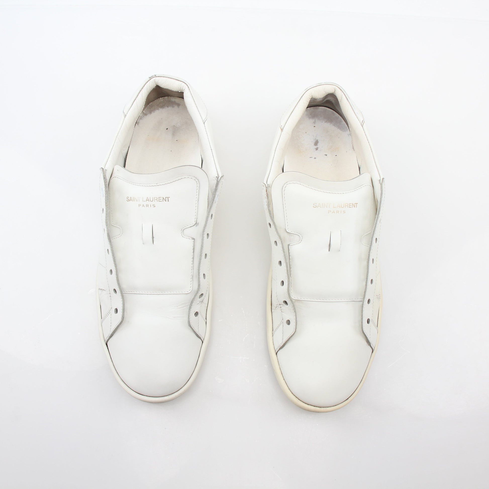 Gold & Beyond Saint Laurent White SL/06 Court Classic Sneakers shown with clean white leather and classic lace-up design.