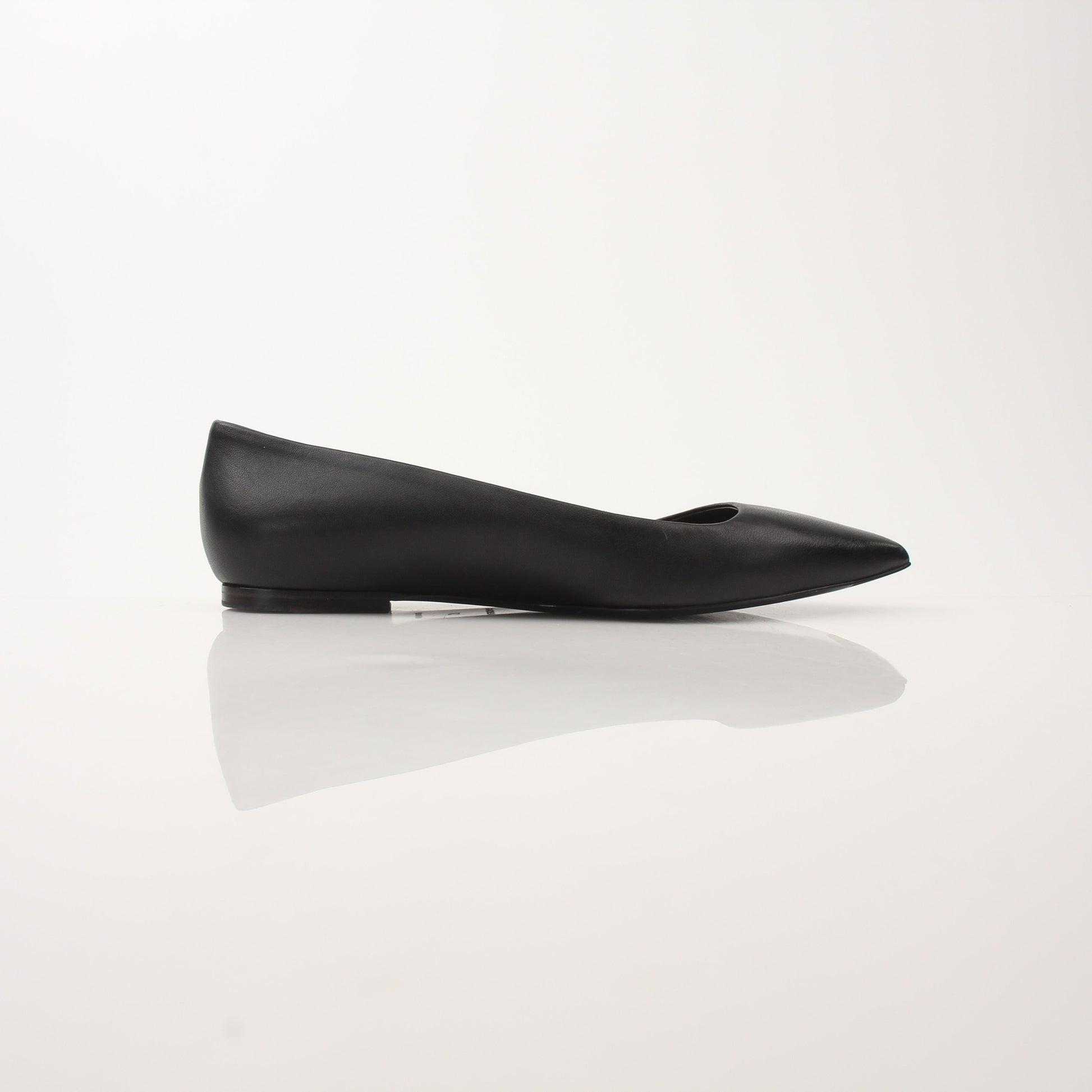 Gold & Beyond leather pointed-toe flats featuring sleek design and elegant stitching, perfect for stylish footwear.