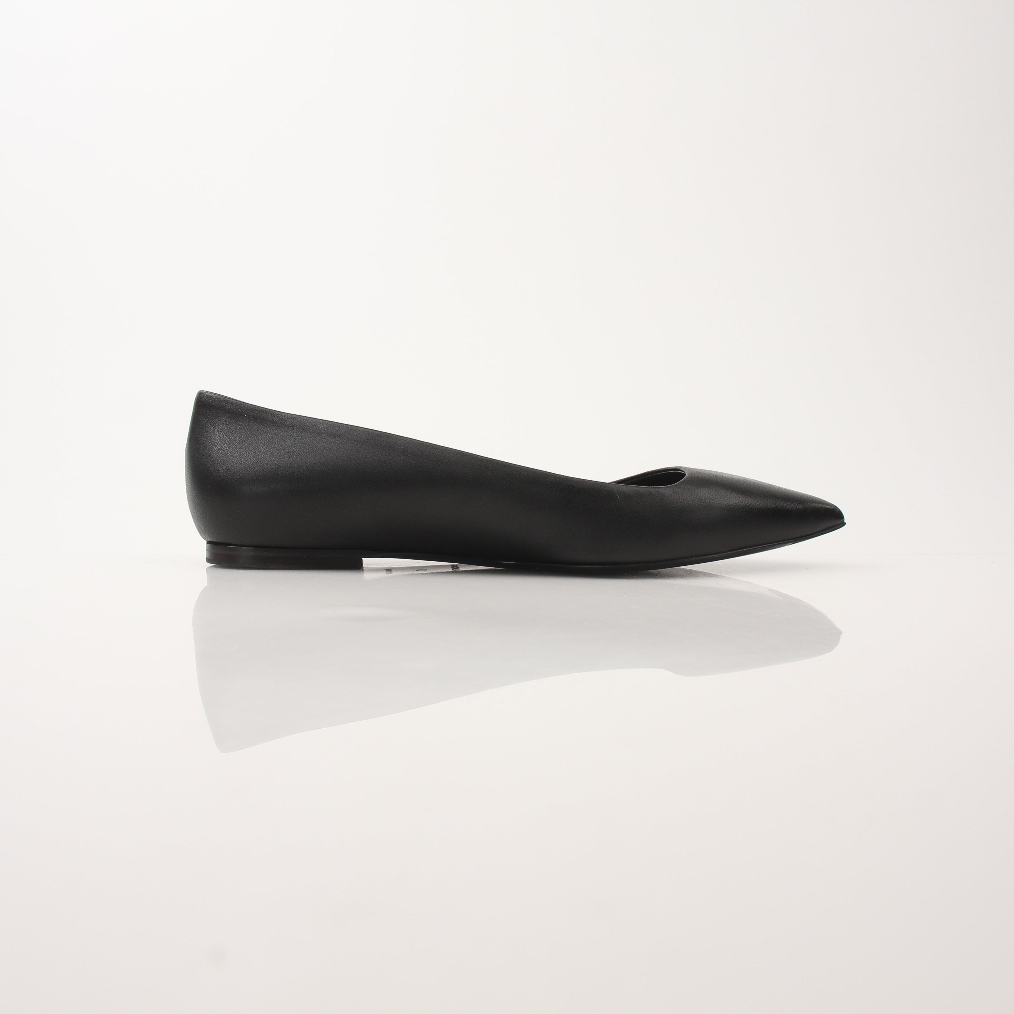 Gold & Beyond leather pointed-toe flats featuring sleek design and elegant stitching, perfect for stylish footwear.
