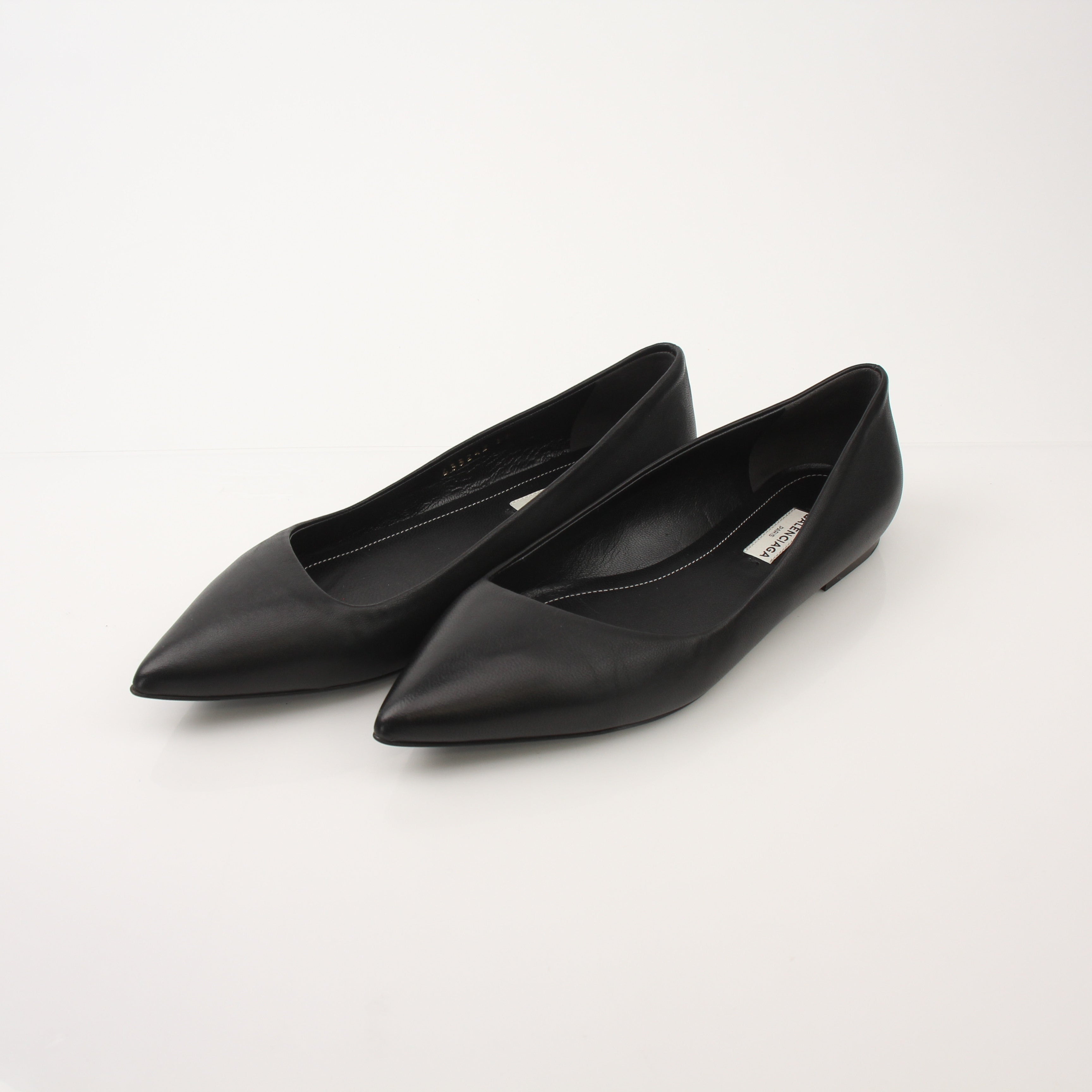 Gold & Beyond leather pointed-toe flats with sleek design, featuring a stylish, comfortable shoe by Balenciaga.