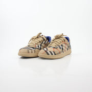 Gold & Beyond Burberry Vintage Check Terrace low-top sneakers featuring iconic check pattern and white rubber soles.