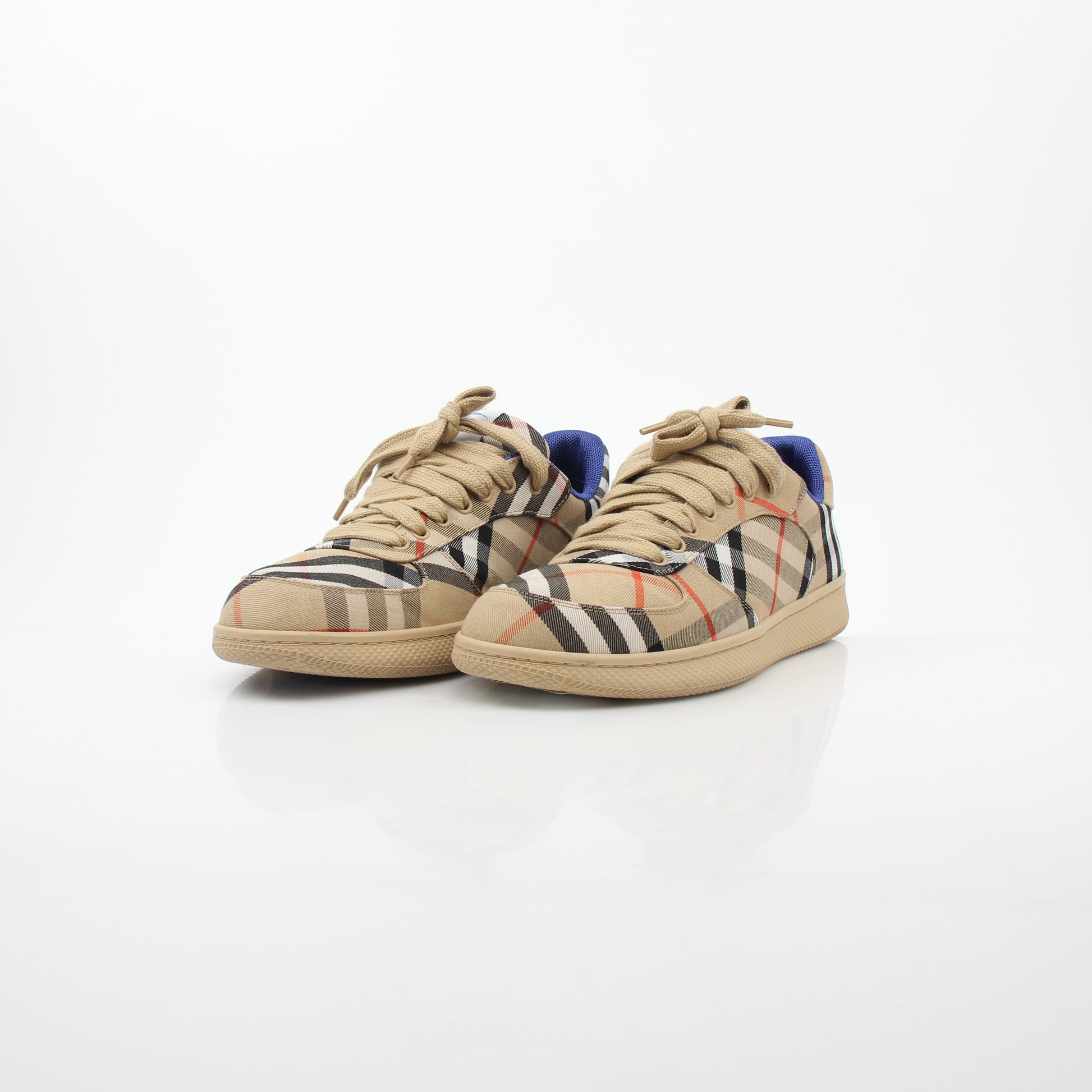 Gold & Beyond Burberry Vintage Check Terrace low-top sneakers featuring iconic check pattern and white rubber soles.