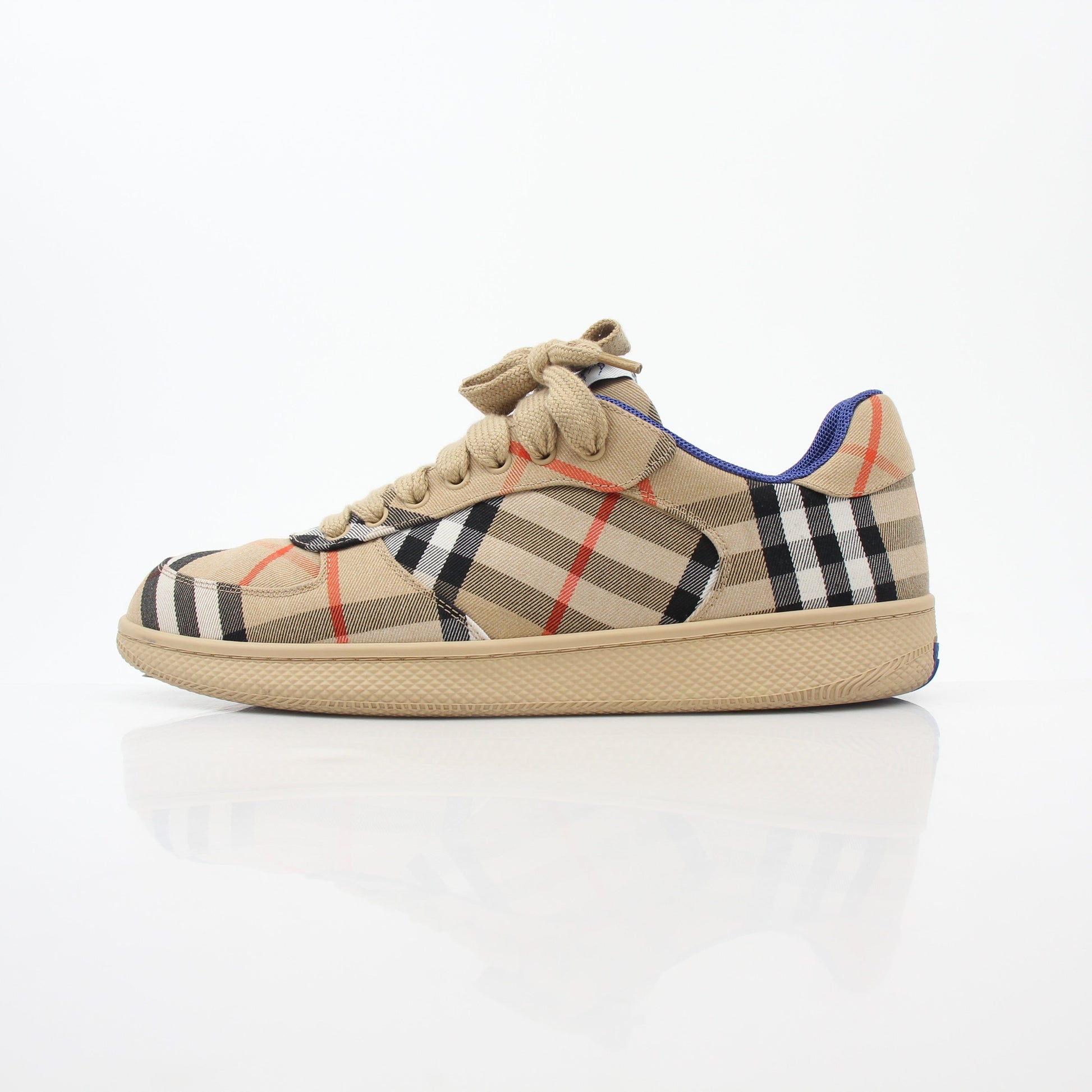 Gold & Beyond Burberry Vintage Check Terrace low-top sneakers with classic check pattern and white rubber soles.
