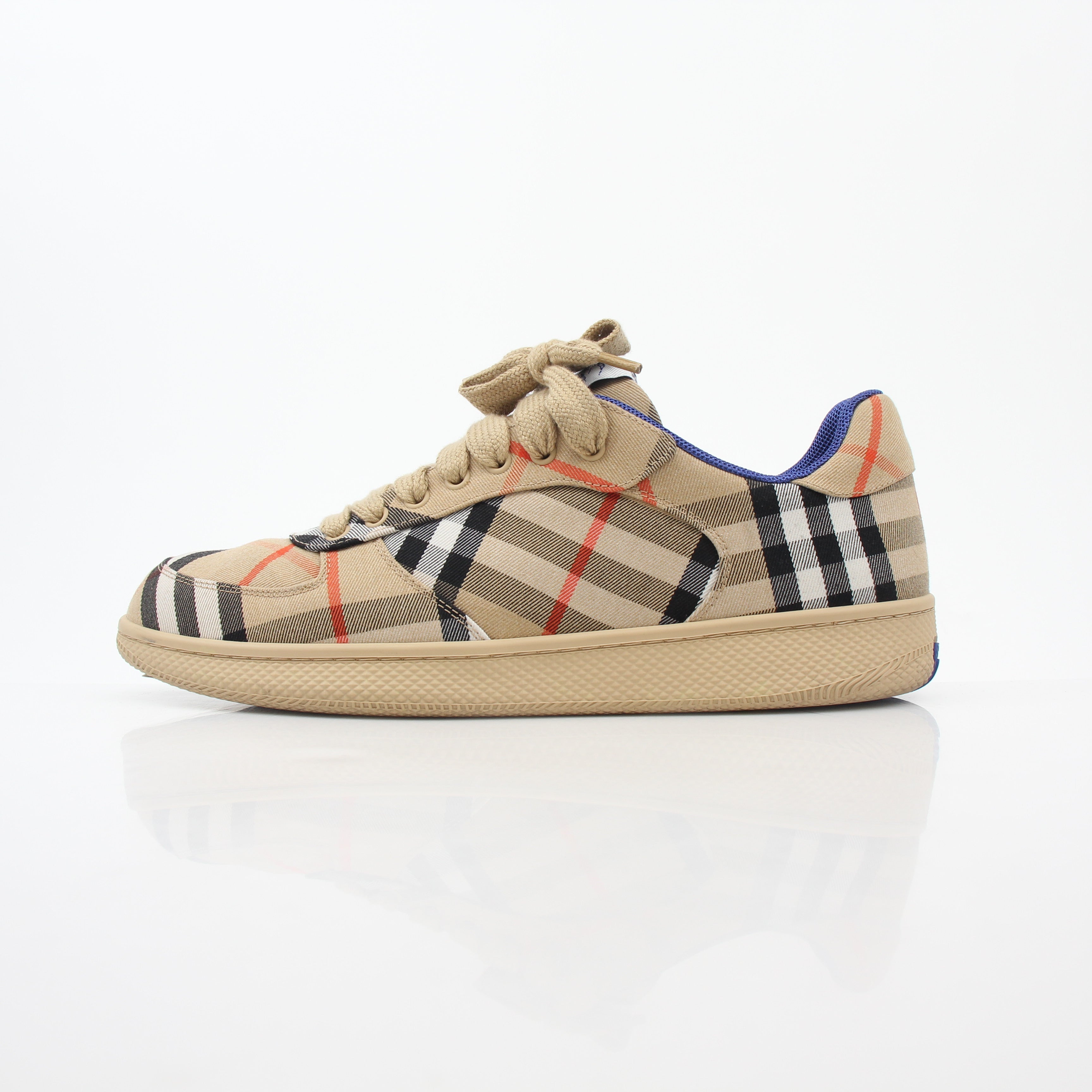 Gold & Beyond Burberry Vintage Check Terrace low-top sneakers with classic check pattern and white rubber soles.