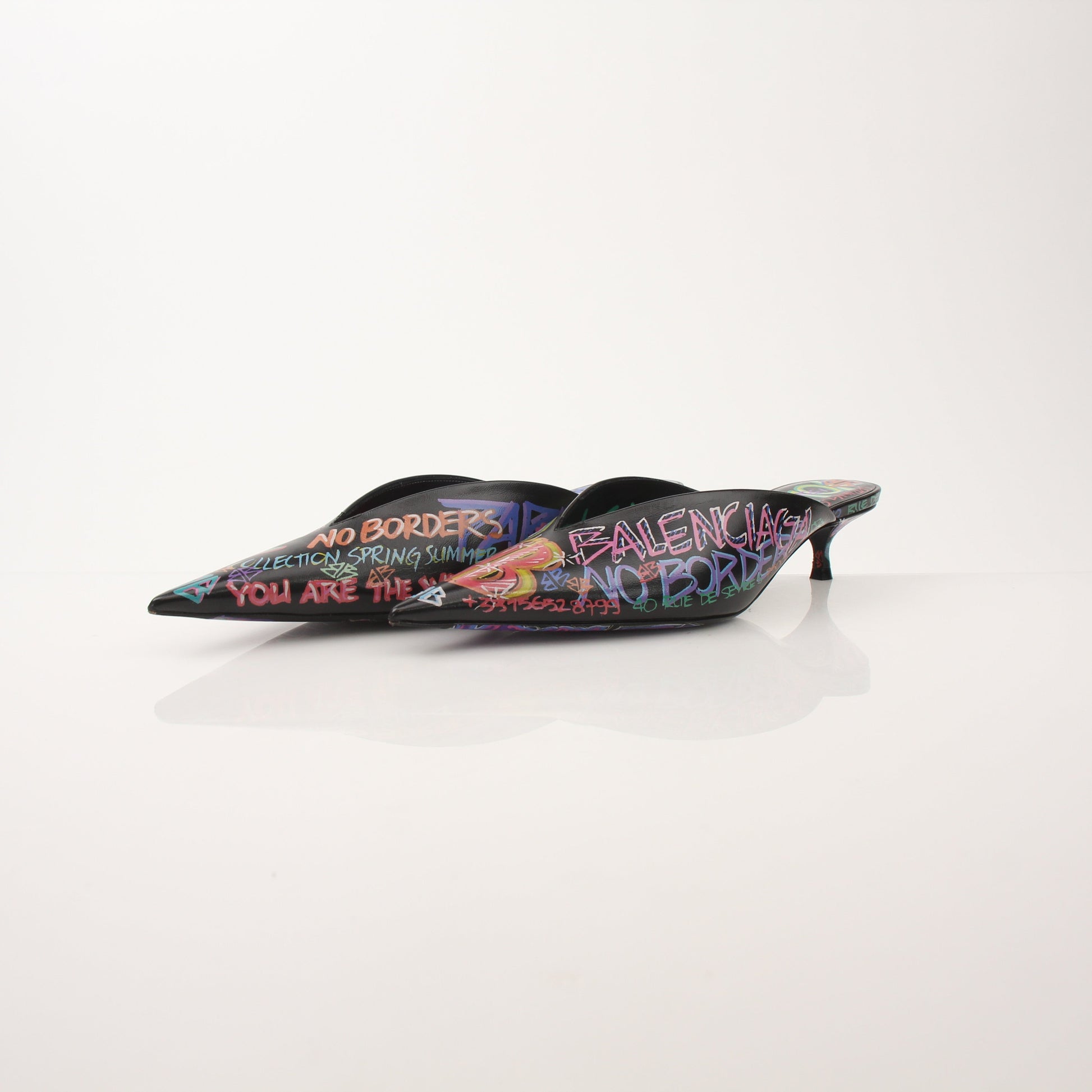 Gold & Beyond Balenciaga Graffiti Knife Mules heels with bold graffiti design and pointed toe on stylish footwear.