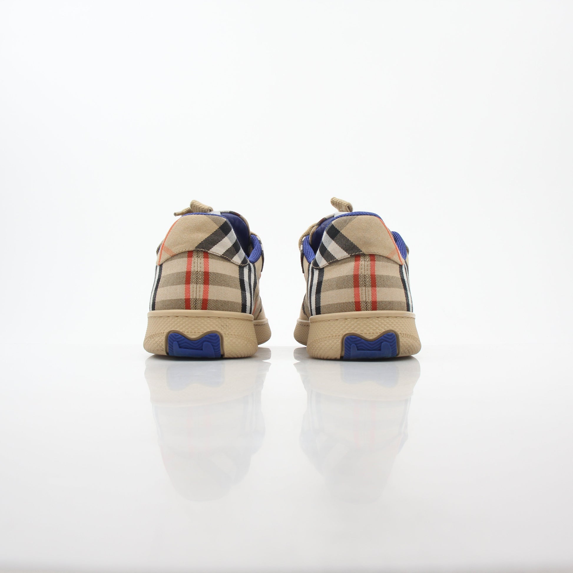 Gold & Beyond Burberry Vintage Check Terrace low-top sneakers with classic plaid pattern and white rubber sole.