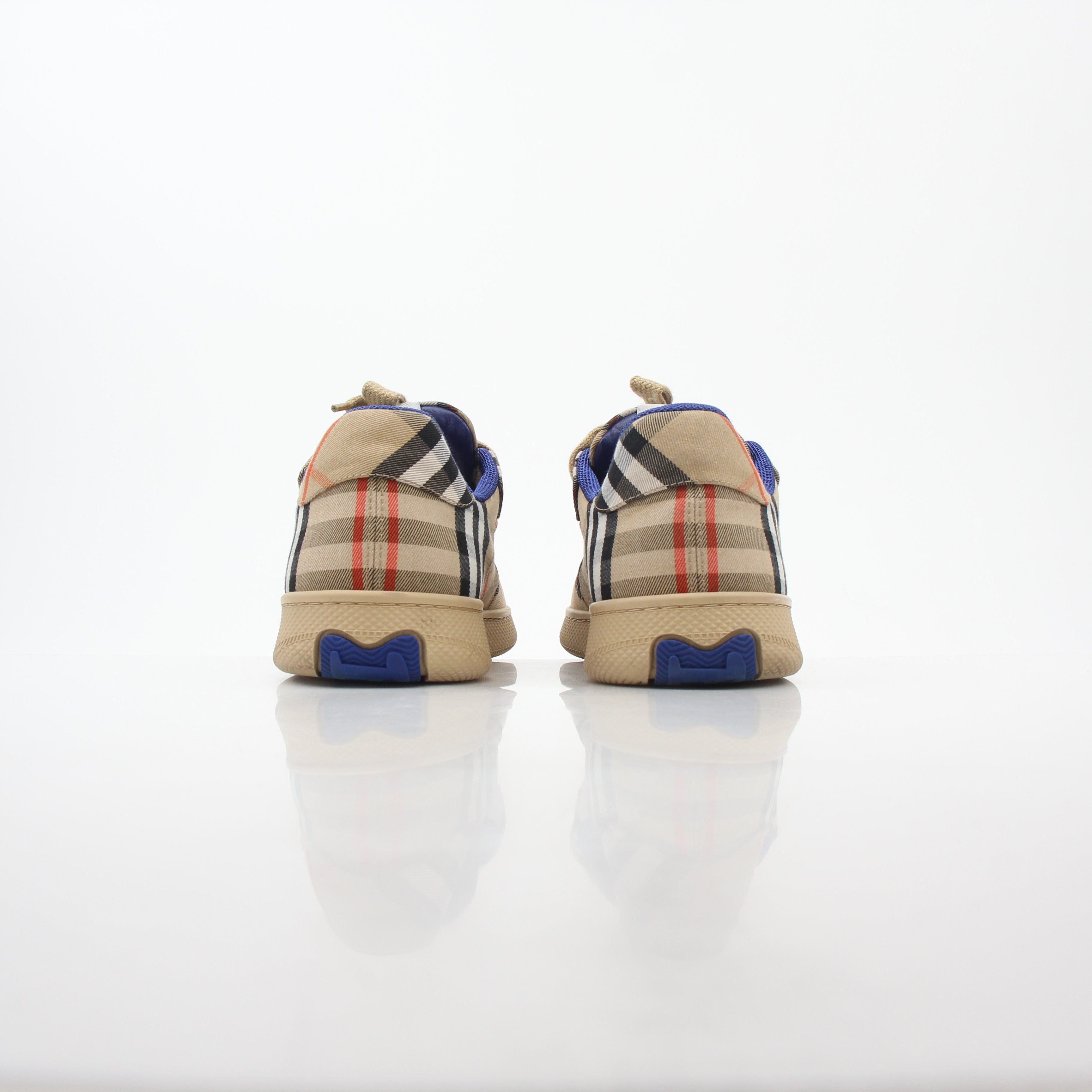 Gold & Beyond Burberry Vintage Check Terrace low-top sneakers with classic plaid pattern and white rubber sole.