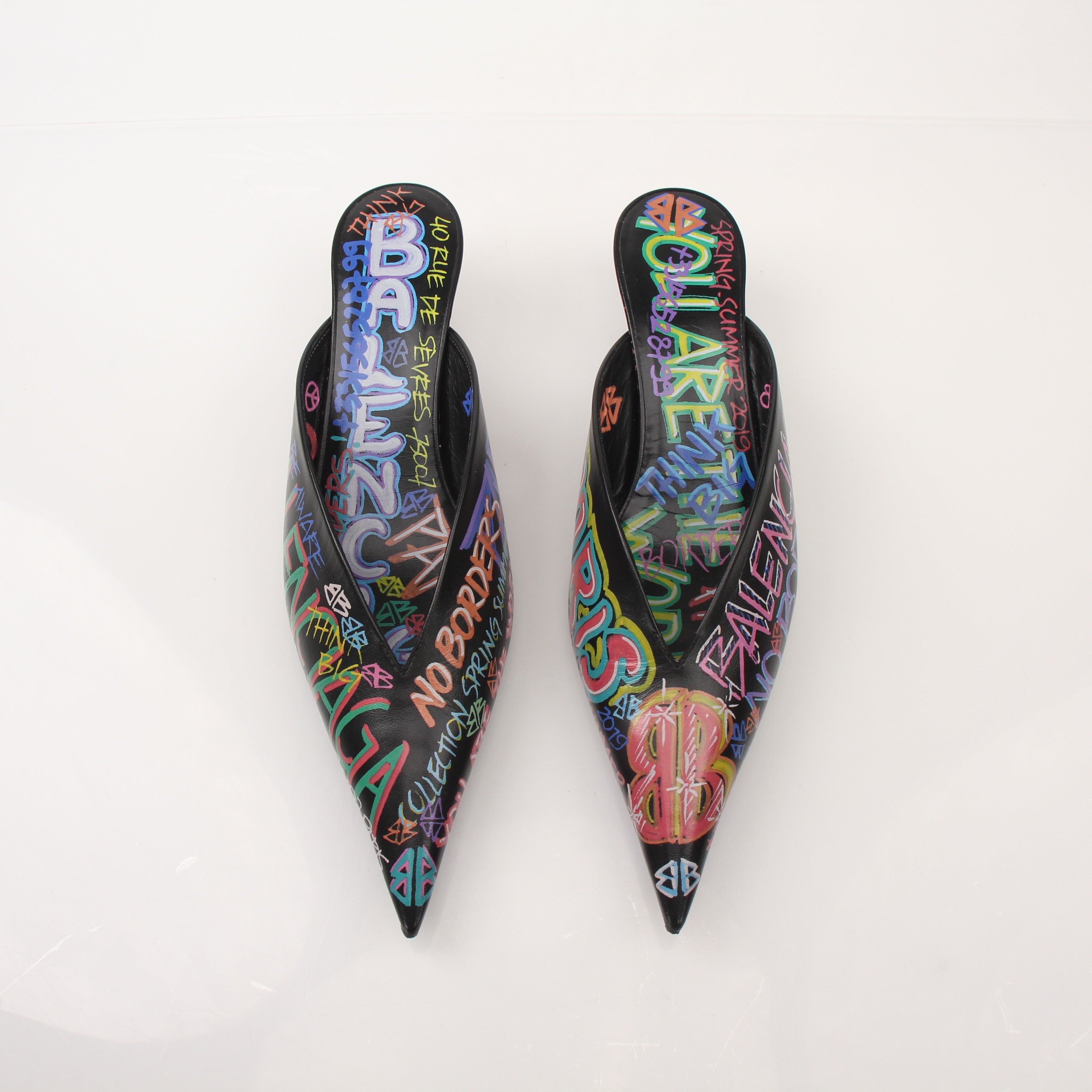 Gold & Beyond Balenciaga Graffiti Knife Mules heels with bold graffiti design and sleek silhouette on a neutral background.