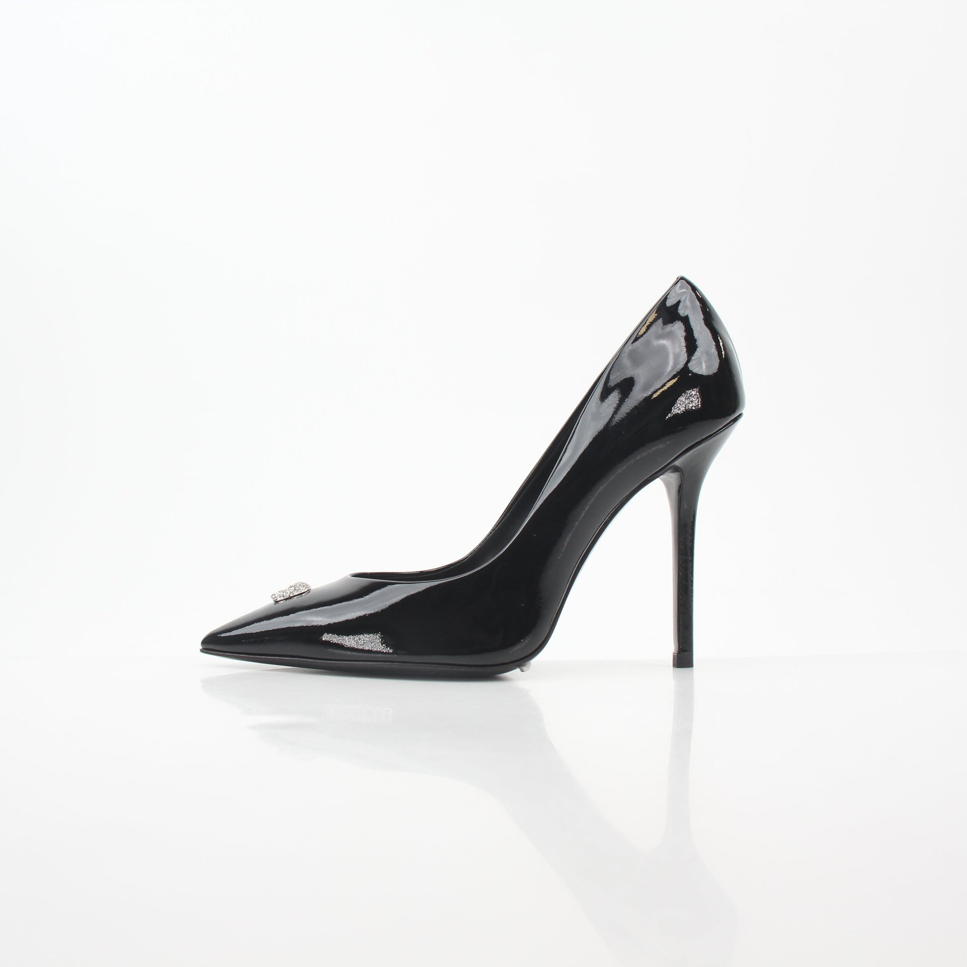 Philipp Plein Black Patent Leather Crystal Skull Heels with pointed toes and decorative skull embellishments on the heels.
