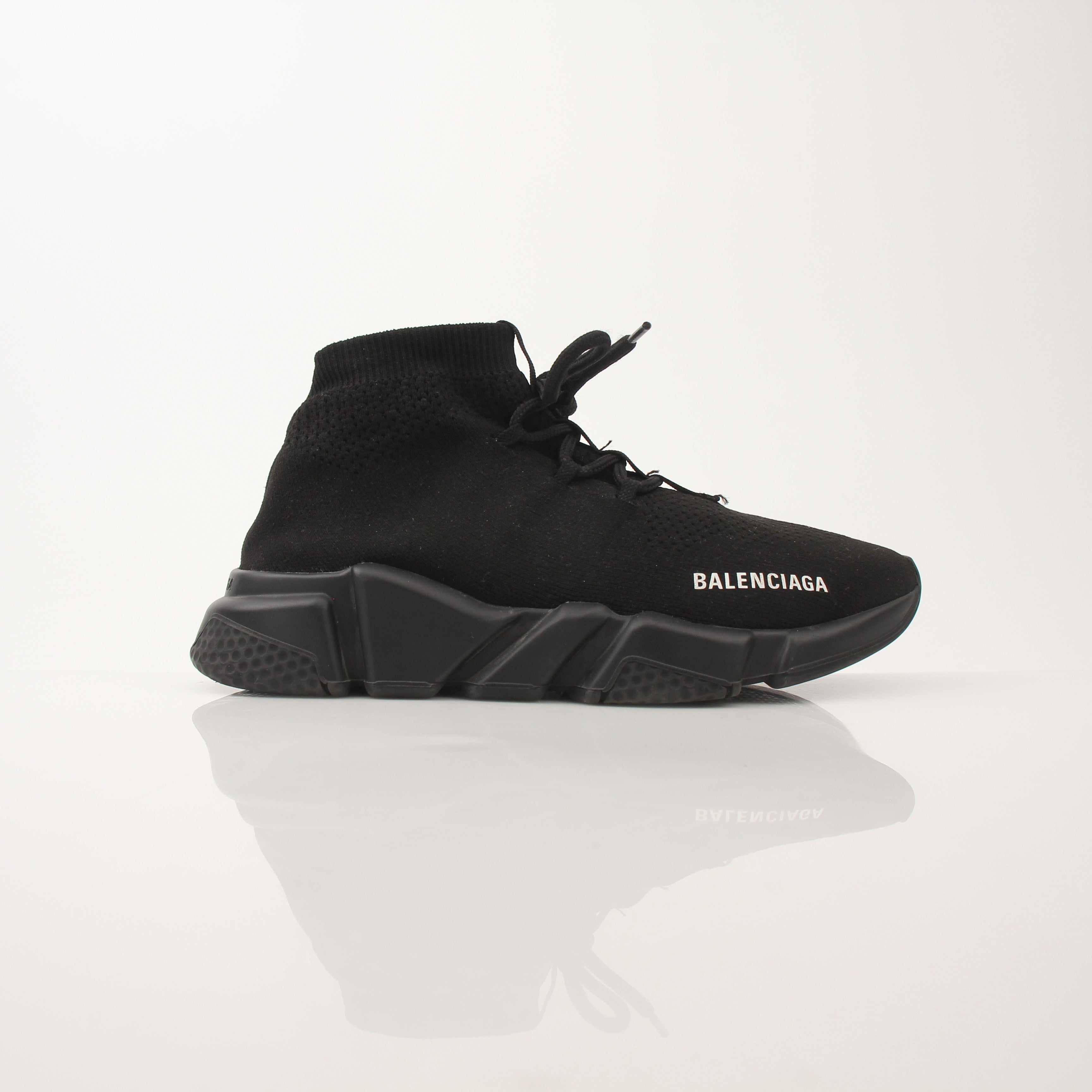 Gold & Beyond Balenciaga Speed lace-up sneakers featuring sleek design and stylish athletic shoes for casual wear.