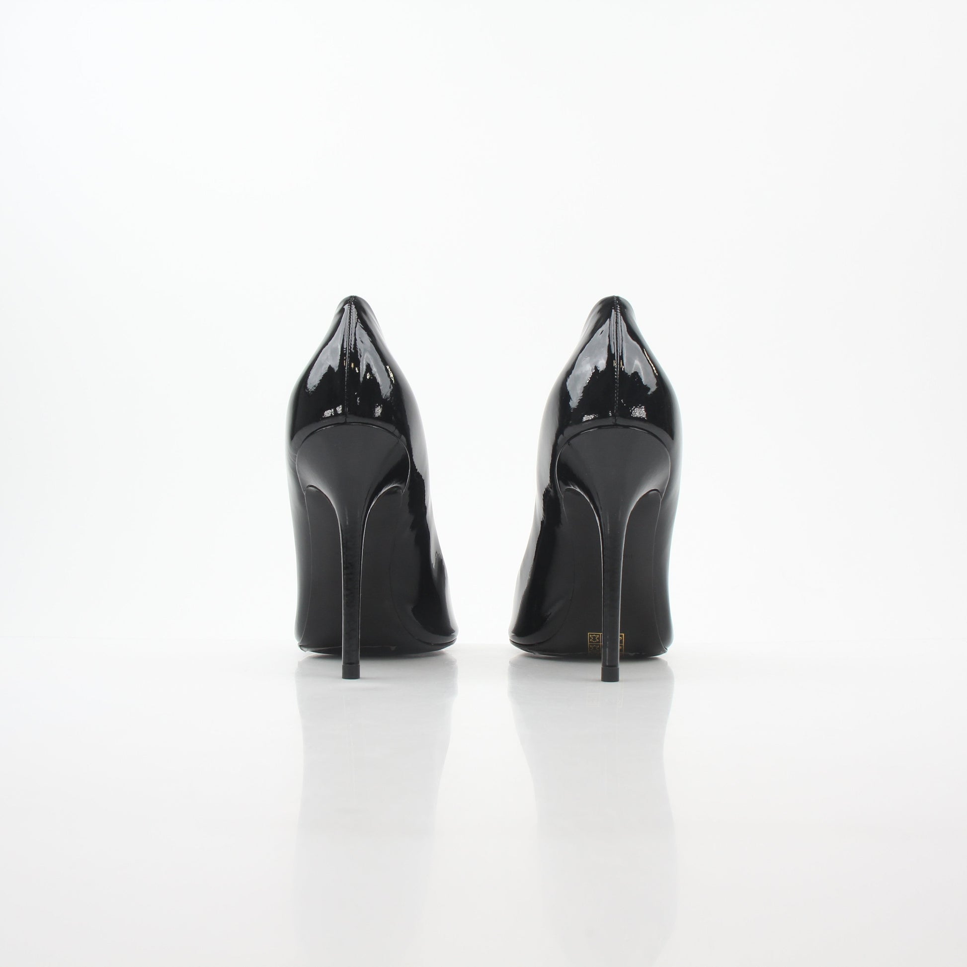 Black patent leather Philipp Plein crystal skull heels with pointed toes and stiletto heels, detailed with crystal embellishments.
