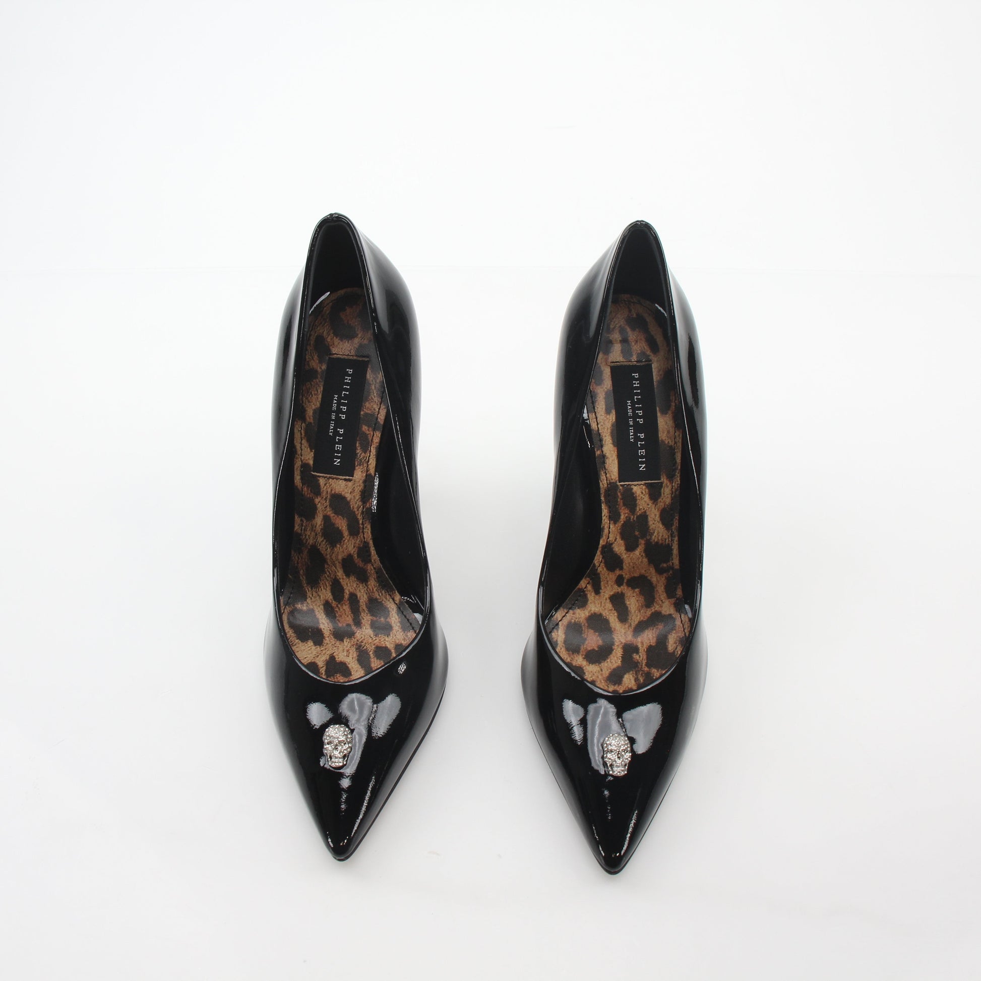 Philipp Plein black patent leather crystal skull décolleté heels with pointed toes and decorative embellishments.