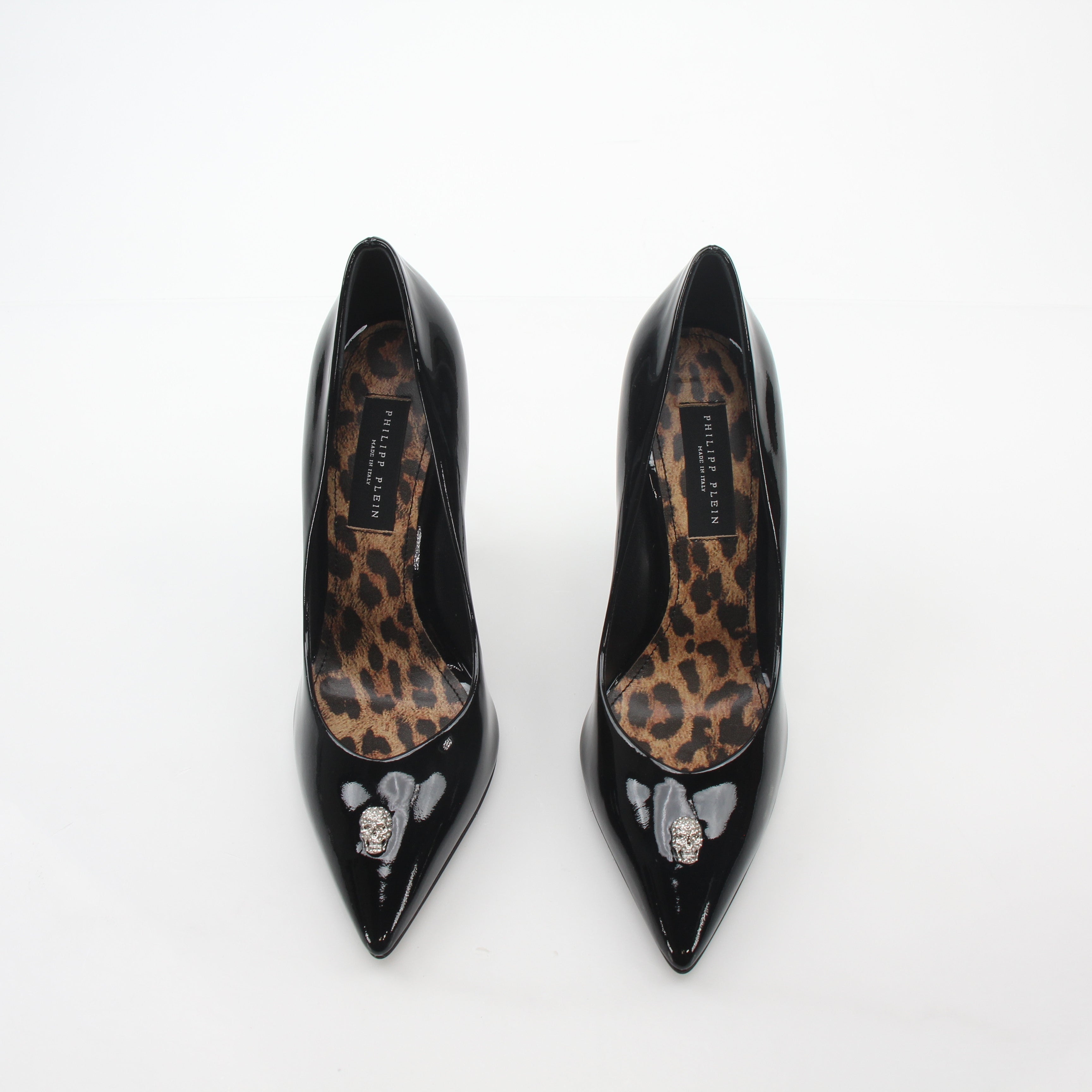 Philipp Plein black patent leather crystal skull décolleté heels with pointed toes and decorative embellishments.