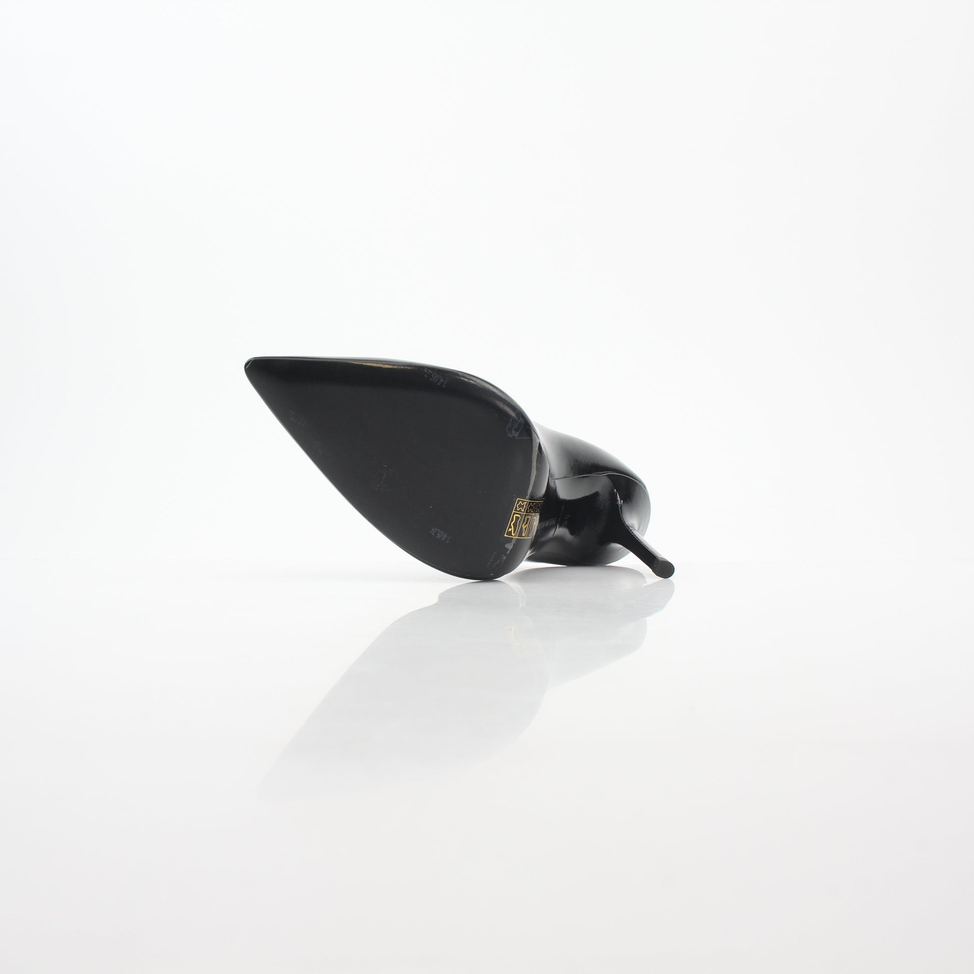 Black patent leather Philipp Plein skull heels with crystal embellishments, stylish décolleté design, from Gold & Beyond.
