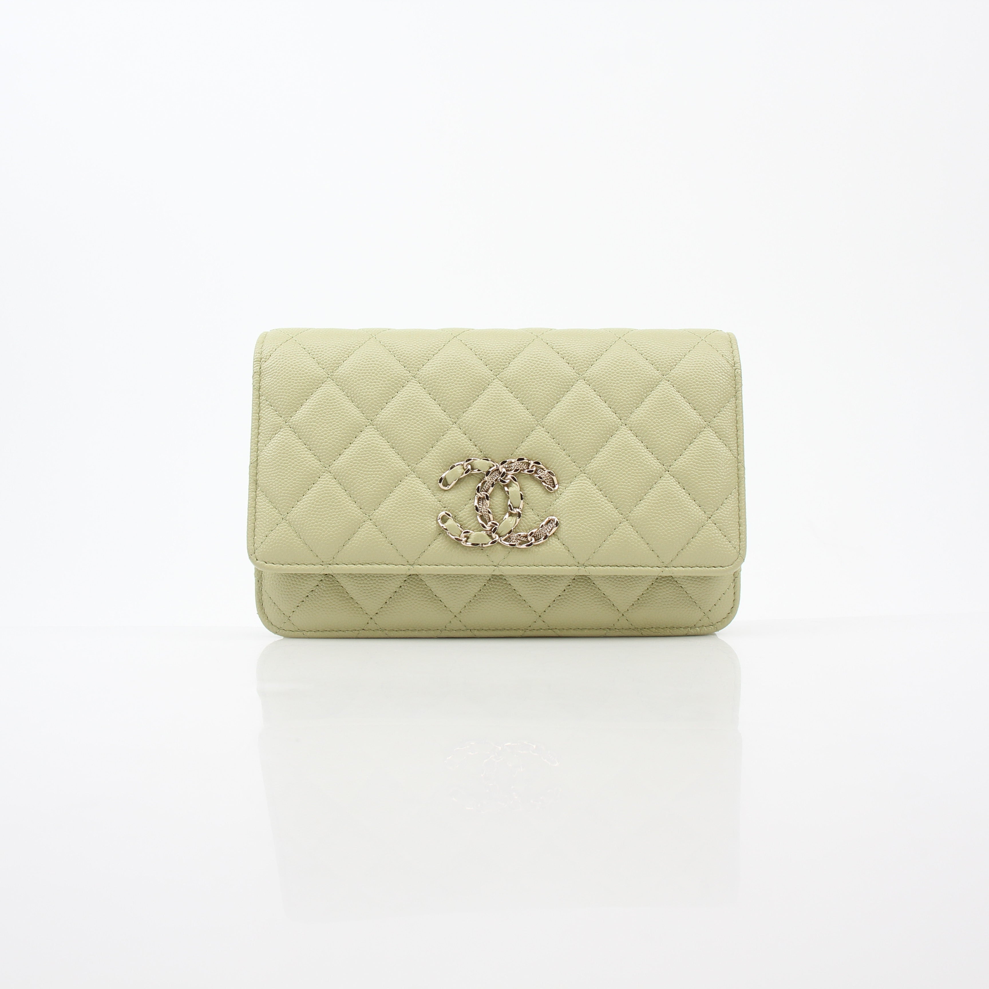 Light green Chanel Caviar French New Wave Chain CC wallet on chain handbag with gold hardware and signature quilting.