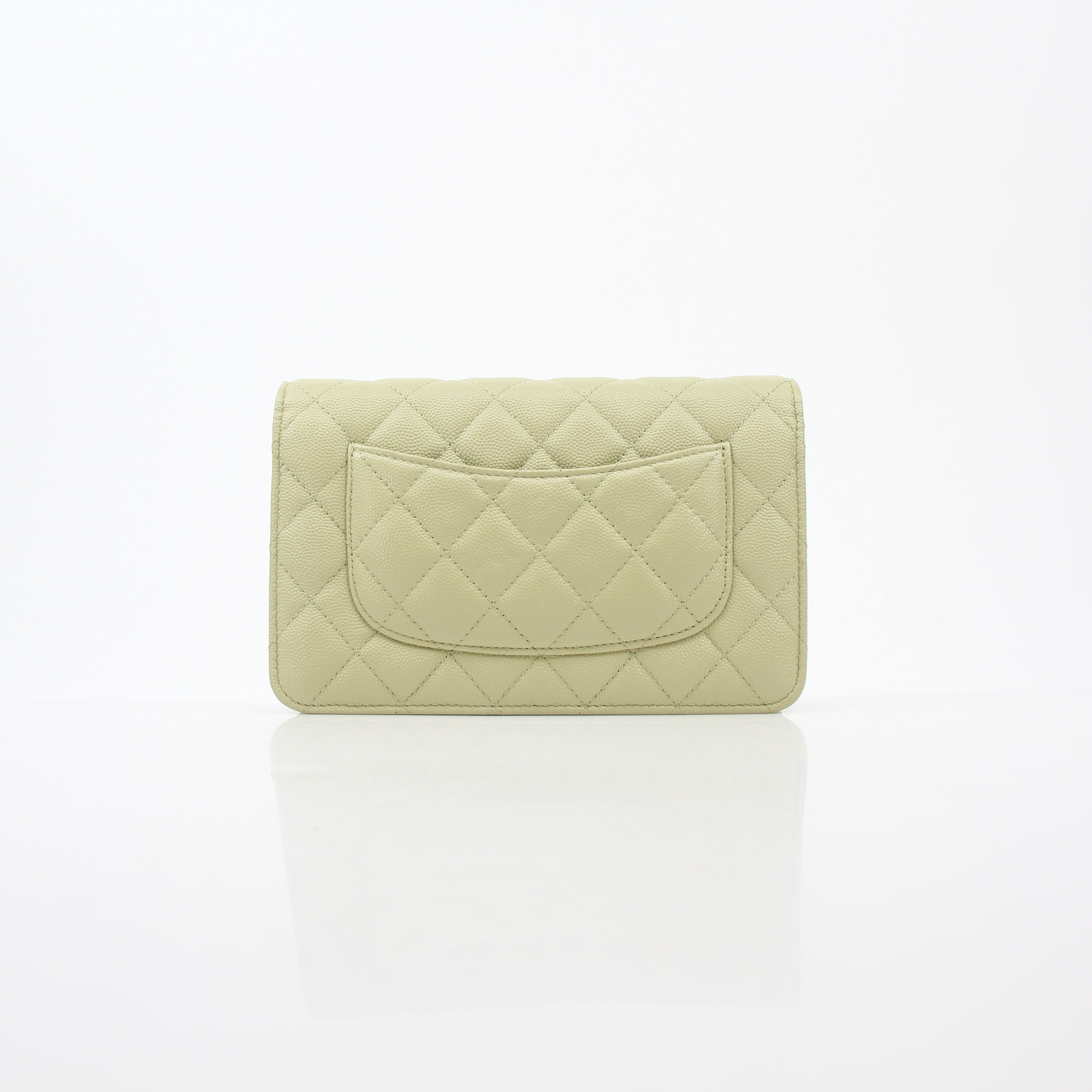 Light green Chanel Caviar French New Wave Chain CC wallet on chain handbag with gold accents, featuring a classic luxury design.