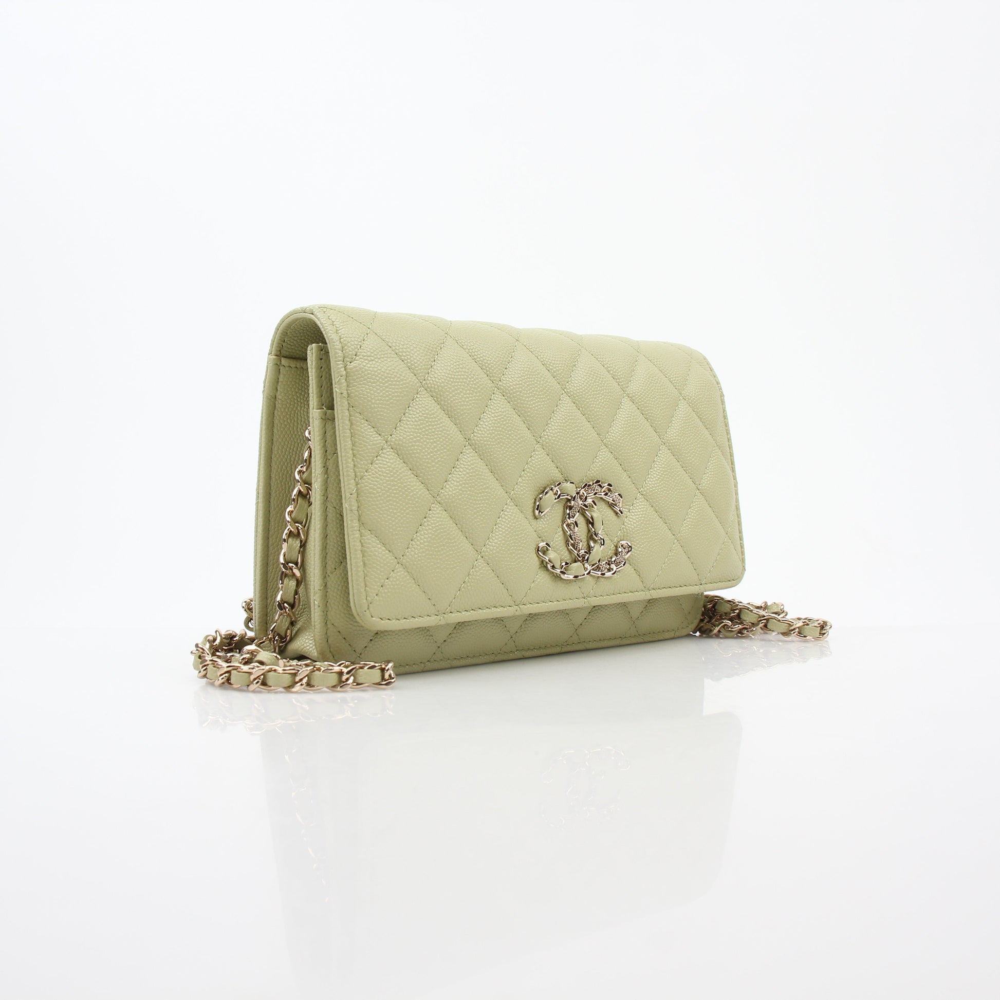 Light green Chanel Caviar French New Wave Chain CC wallet on chain handbag with gold accents and chain strap.