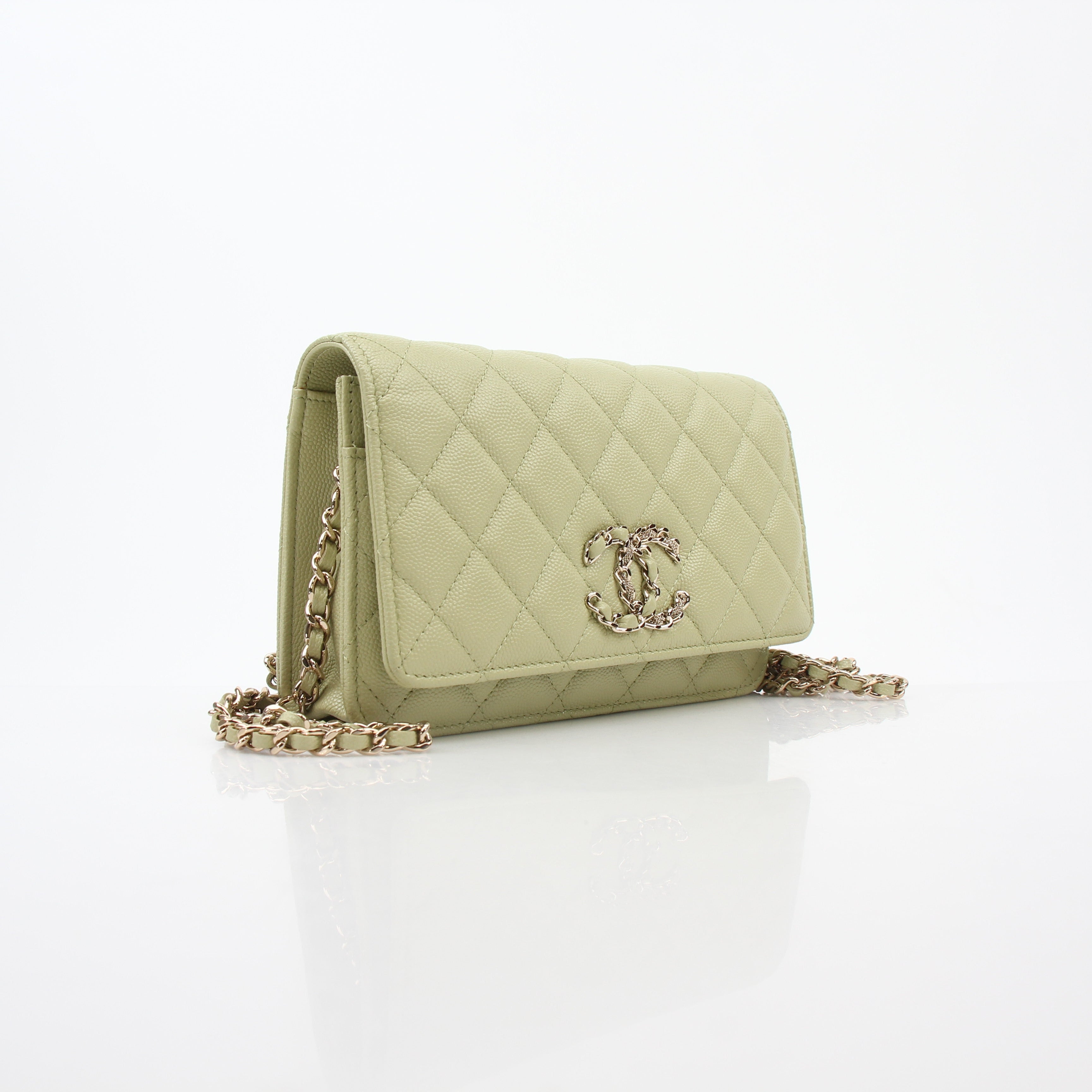 Light green Chanel Caviar French New Wave Chain CC wallet on chain handbag with gold accents and chain strap.