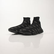 Gold & Beyond Balenciaga women’s All Over Logo Speed 2.0 sneakers, stylish shoes with bold logo design and sporty silhouette.