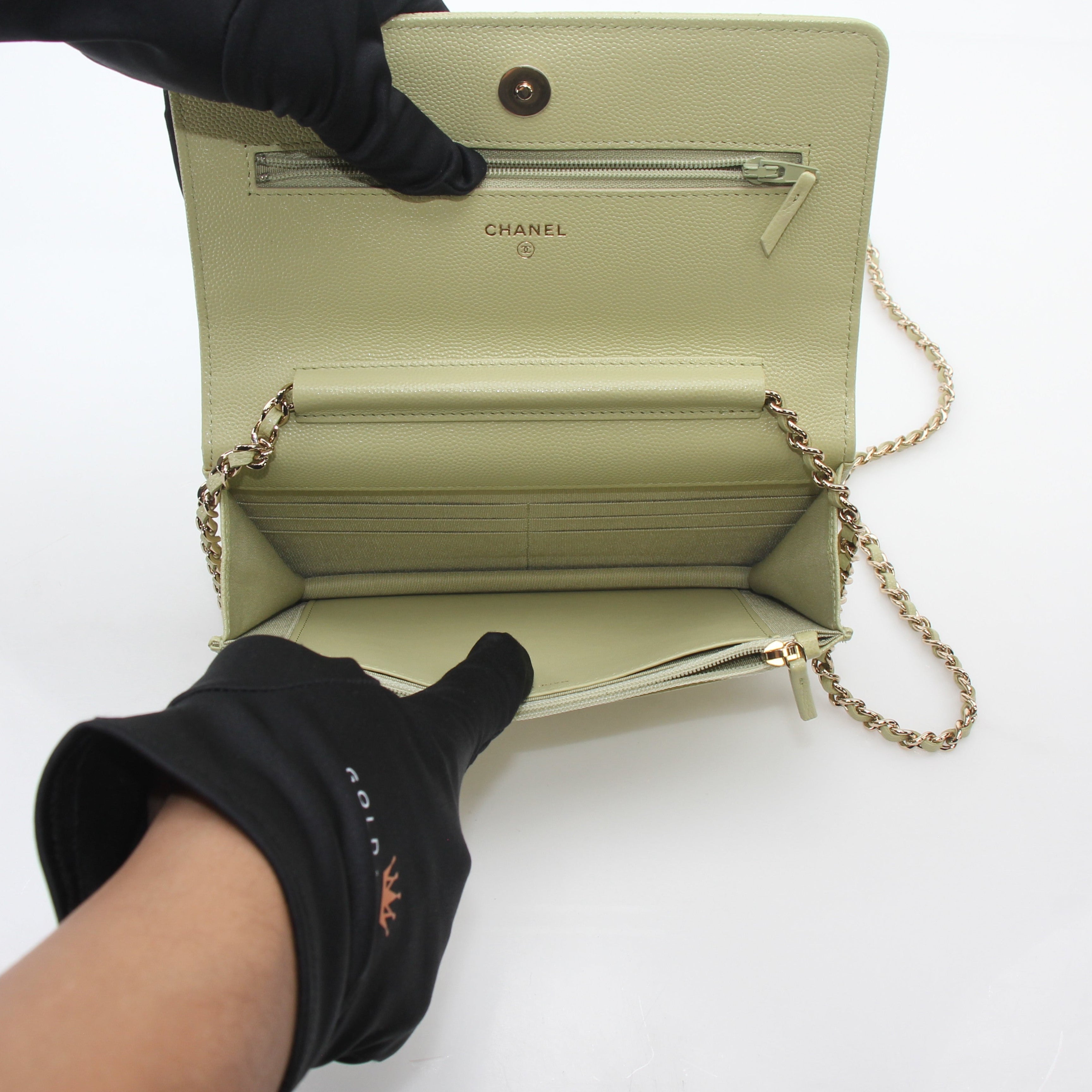 Light green Chanel Caviar French New Wave Chain CC wallet on chain handbag with gold hardware, showcased against a neutral background.