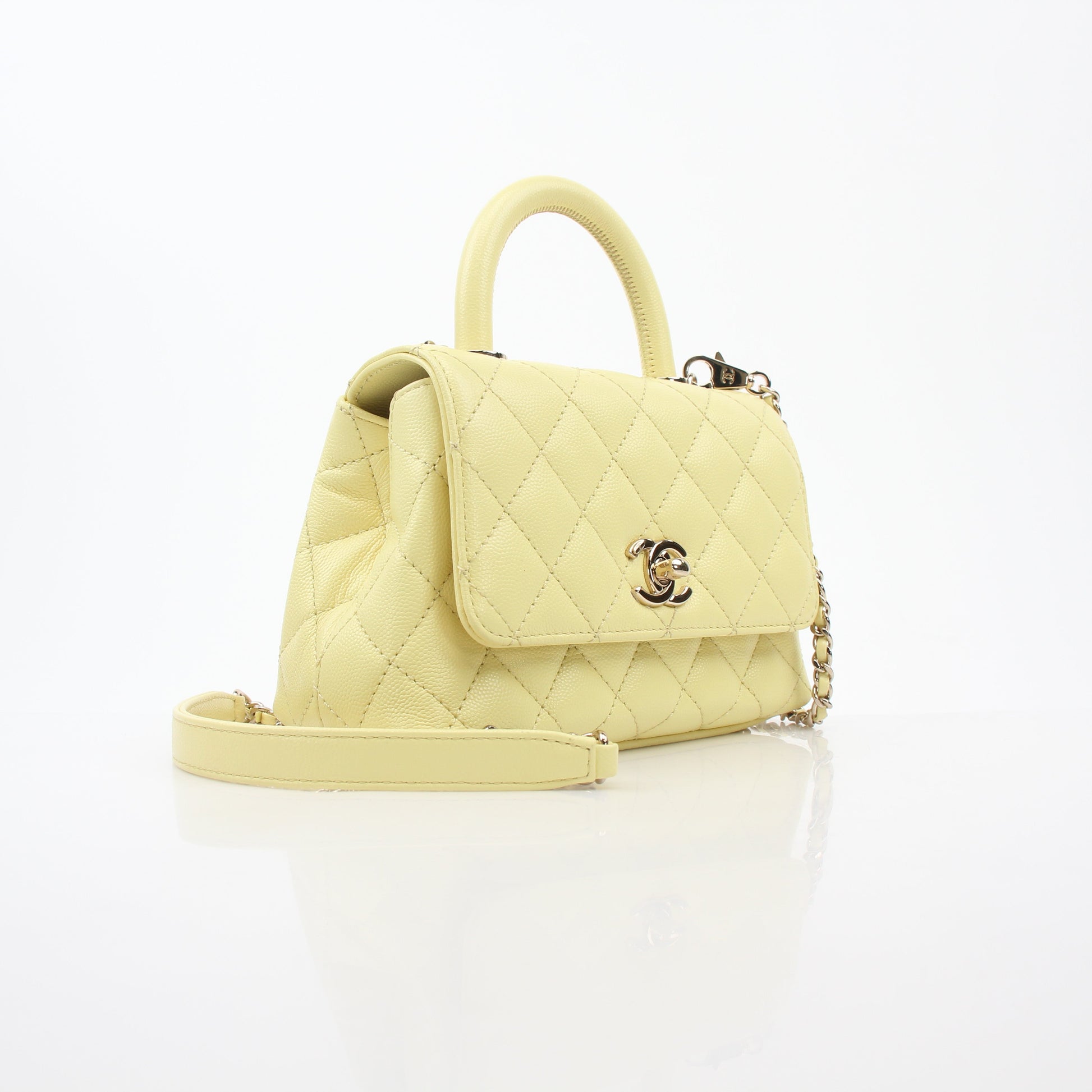Yellow Chanel Mini Coco Handle Flap Bag, elegant handbag with gold accents, from Gold & Beyond.