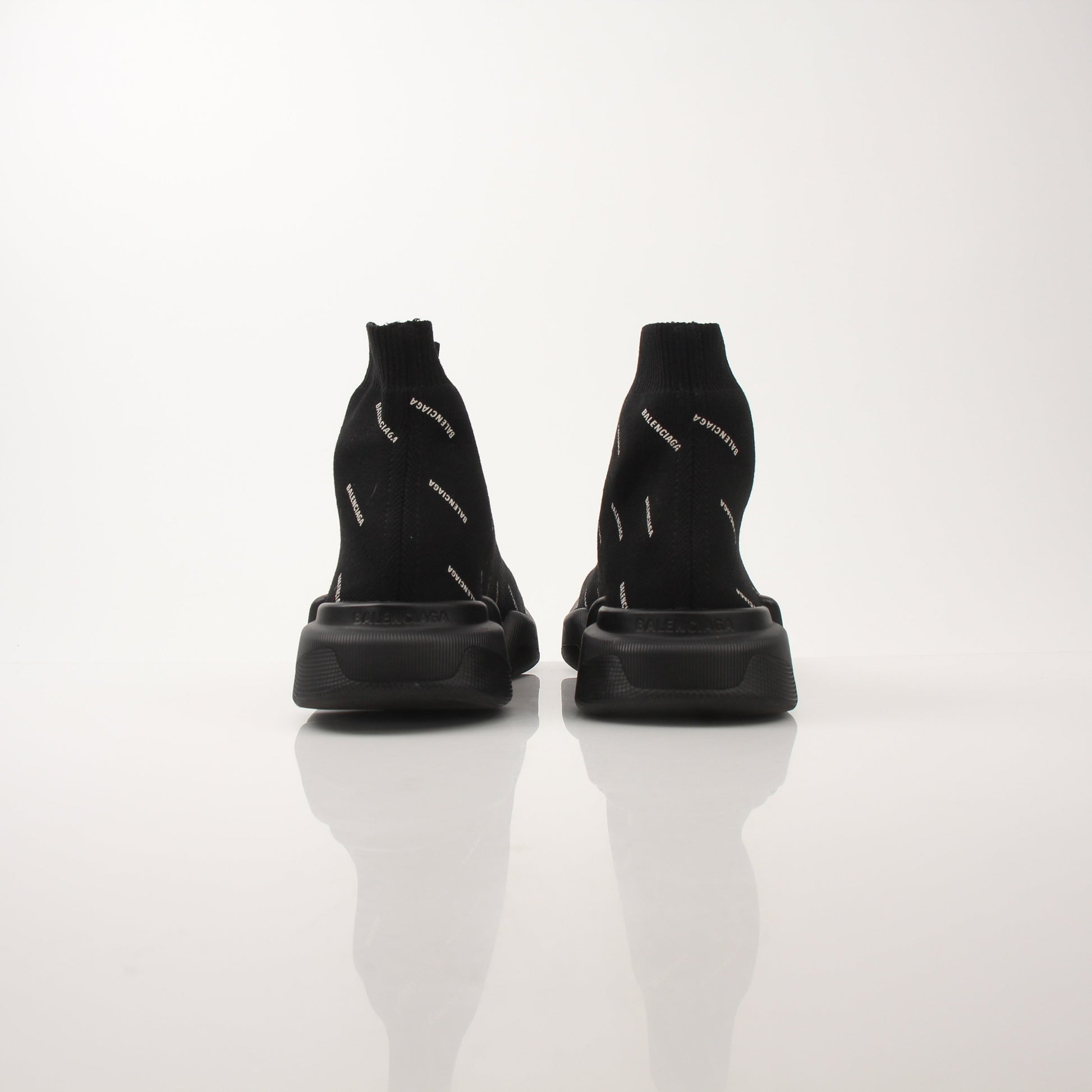 Gold & Beyond Balenciaga Women's All Over Logo Speed 2.0 Sneakers featuring a sleek design and signature logo pattern.