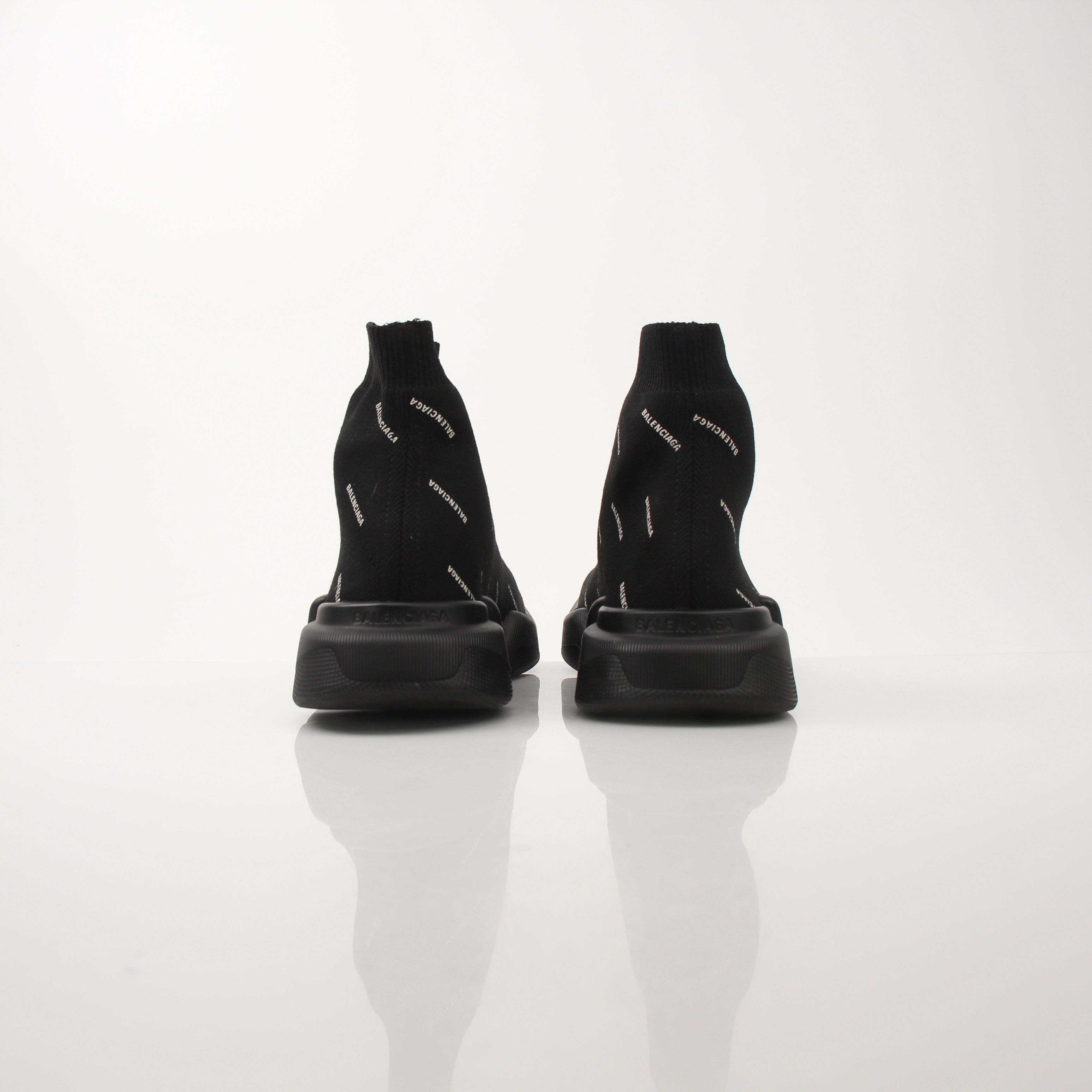 Gold & Beyond Balenciaga Women's All Over Logo Speed 2.0 Sneakers featuring a sleek design and signature logo pattern.