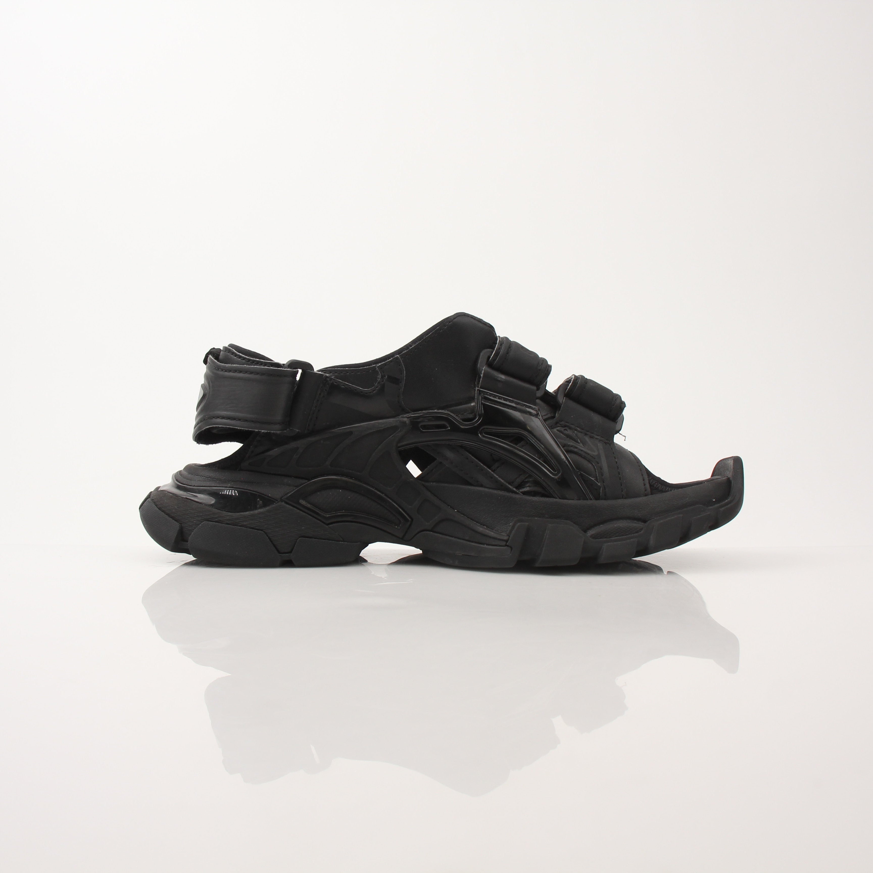 Balenciaga women's track sandals in black with sporty design and chunky sole, displayed on a neutral background.