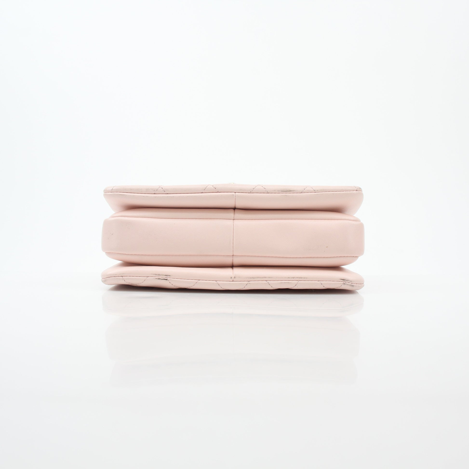 Pink Chanel small trend-setting CC flap handbag with top handle, featuring gold accents and classic design.
