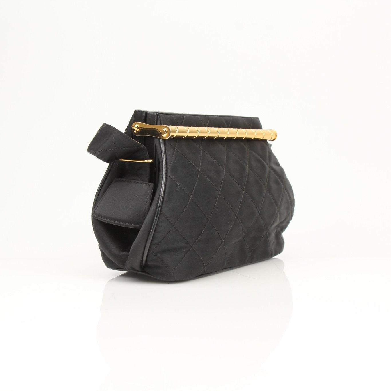 Chanel black classic shoulder handbag with gold chain strap and quilted leather design, displayed on a neutral background.