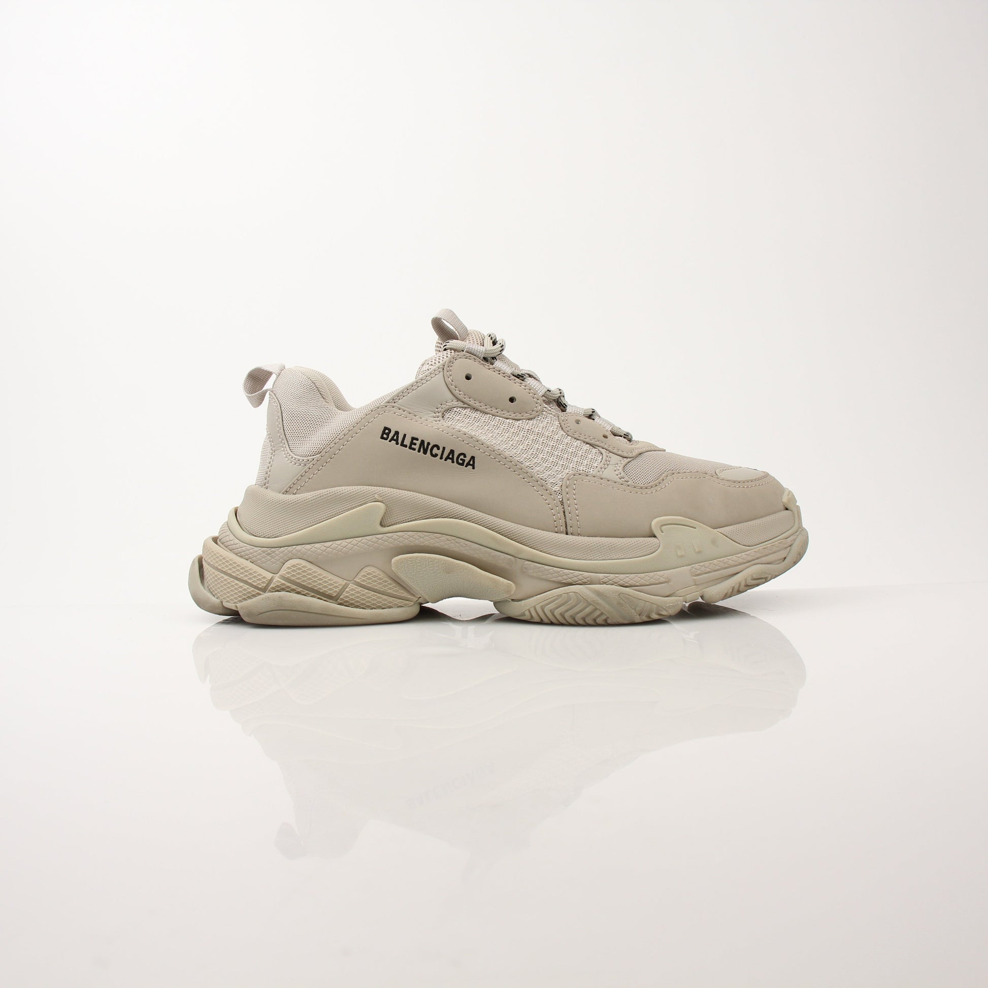 Gold & Beyond men's Balenciaga Triple S sneakers showing chunky design with white and beige color accents.