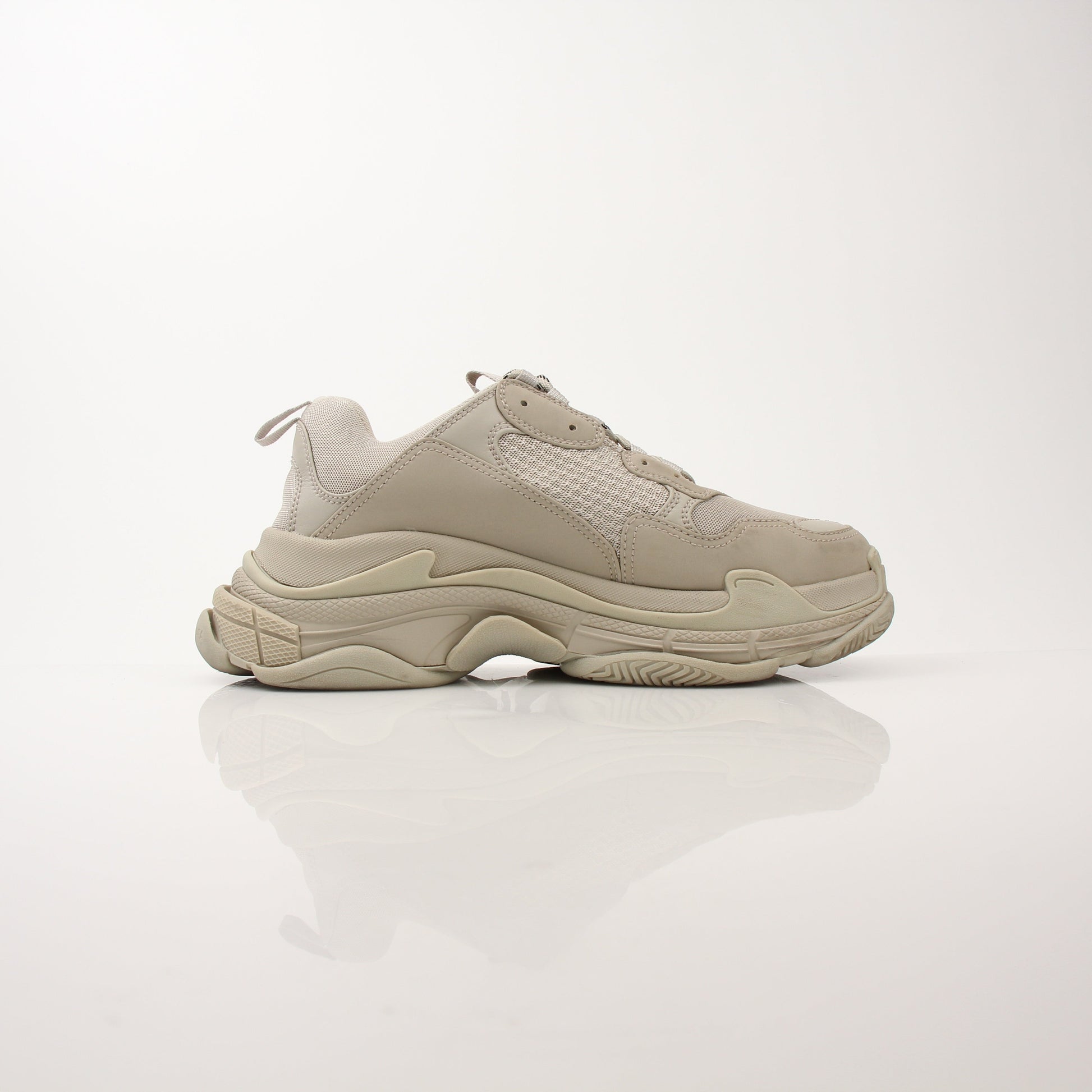 Gold & Beyond men's Balenciaga Triple S sneakers, stylish shoes with chunky design and mixed-materials, front view.