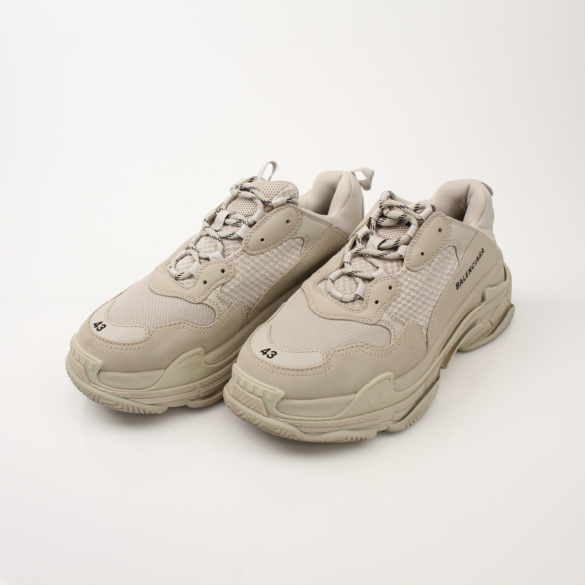 Gold & Beyond men's Balenciaga Triple S sneakers, stylish designer shoes with chunky sole and modern athletic design.