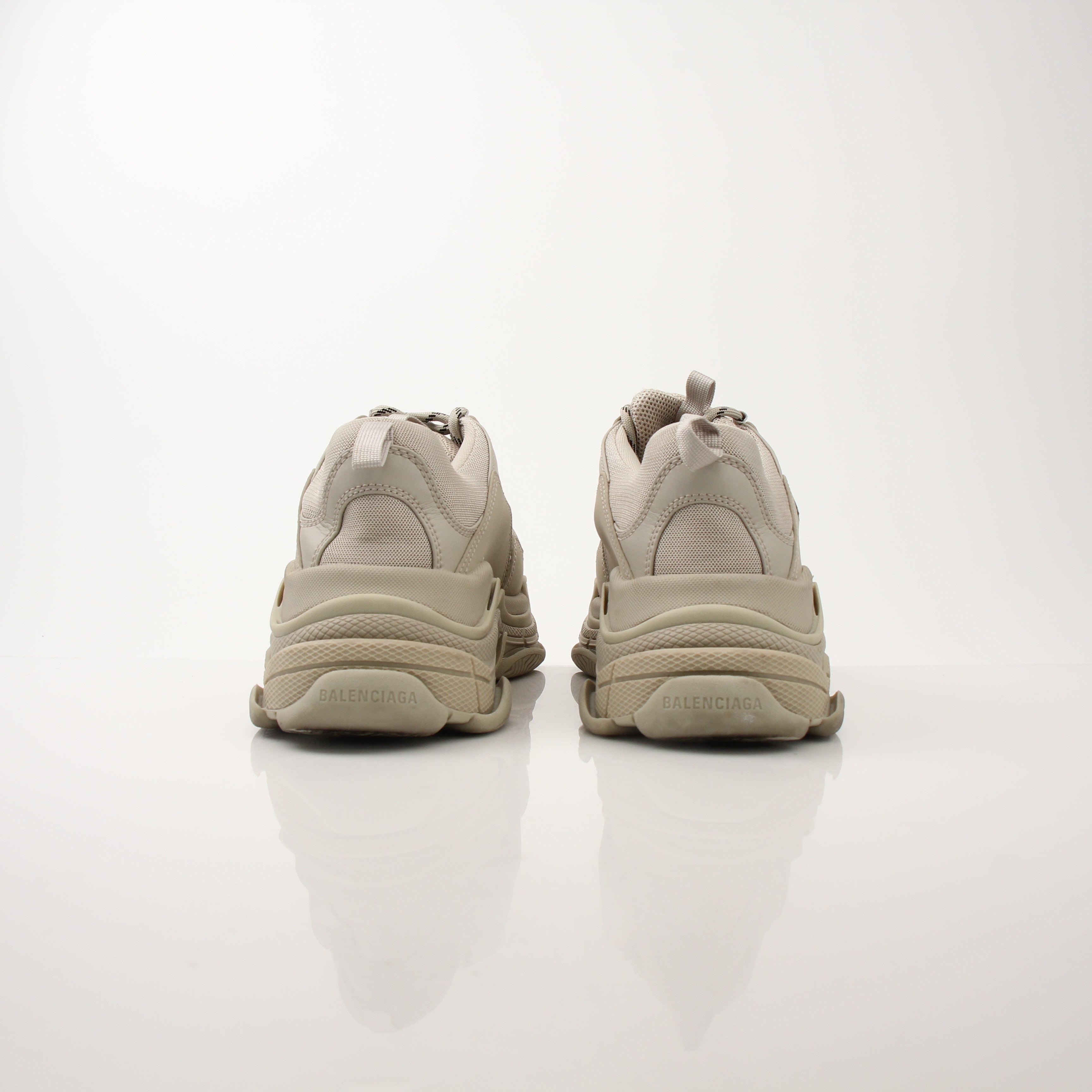 Gold & Beyond men's Balenciaga Triple S sneakers, stylish multi-layered athletic shoes with chunky design and bold branding.